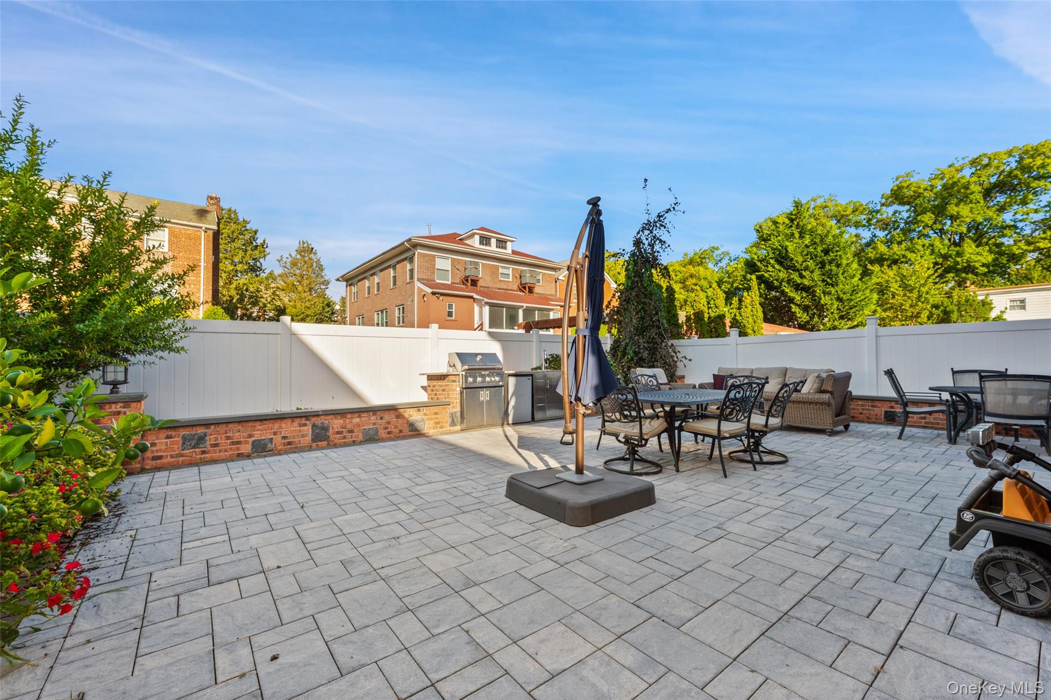 2063 Narragansett Avenue, Unit 2 Bronx, NY 10461 - Photo 26 of 37 Fenced backyard with outdoor dining area and area for grilling
