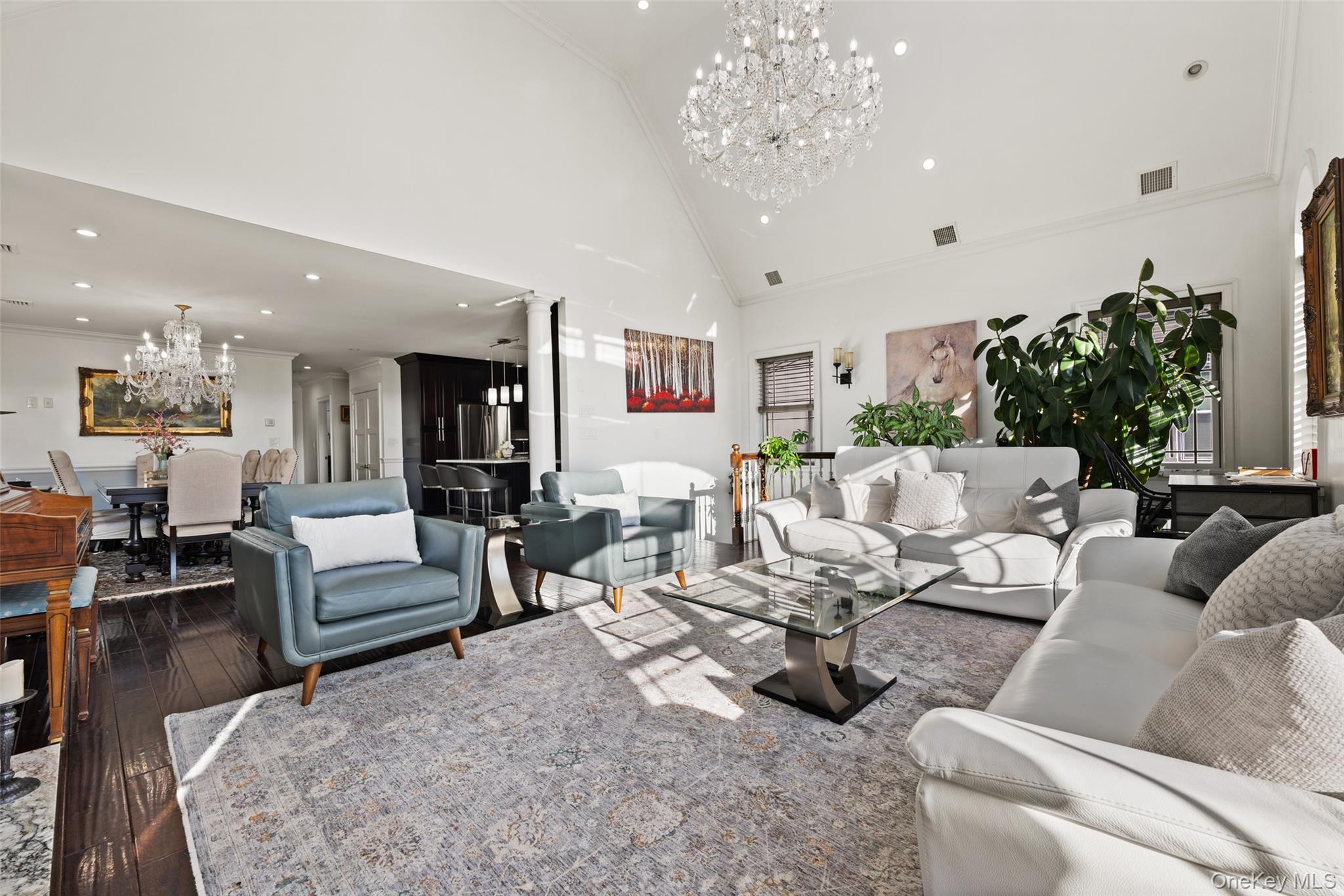 2063 Narragansett Avenue, Unit 2 Bronx, NY 10461 - Photo 4 of 37 Living room featuring a chandelier, crown molding, high vaulted ceiling, dark wood-style flooring, and recessed lighting
