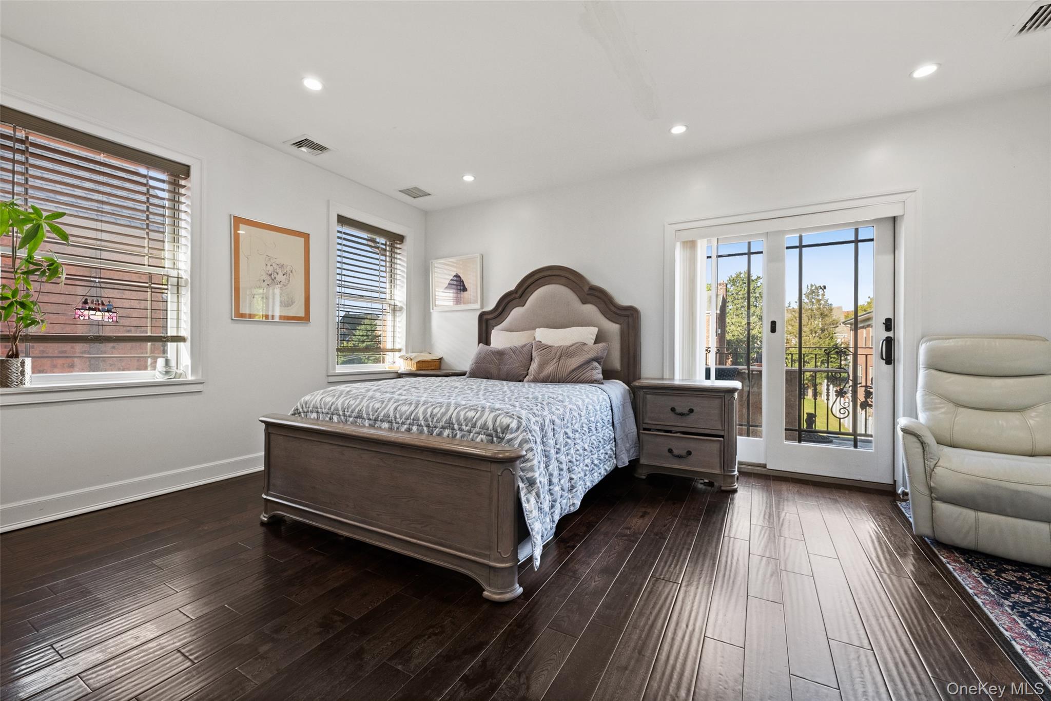 2063 Narragansett Avenue, Unit 2 Bronx, NY 10461 - Photo 6 of 37 Bedroom featuring access to outside, recessed lighting, and dark wood-style flooring