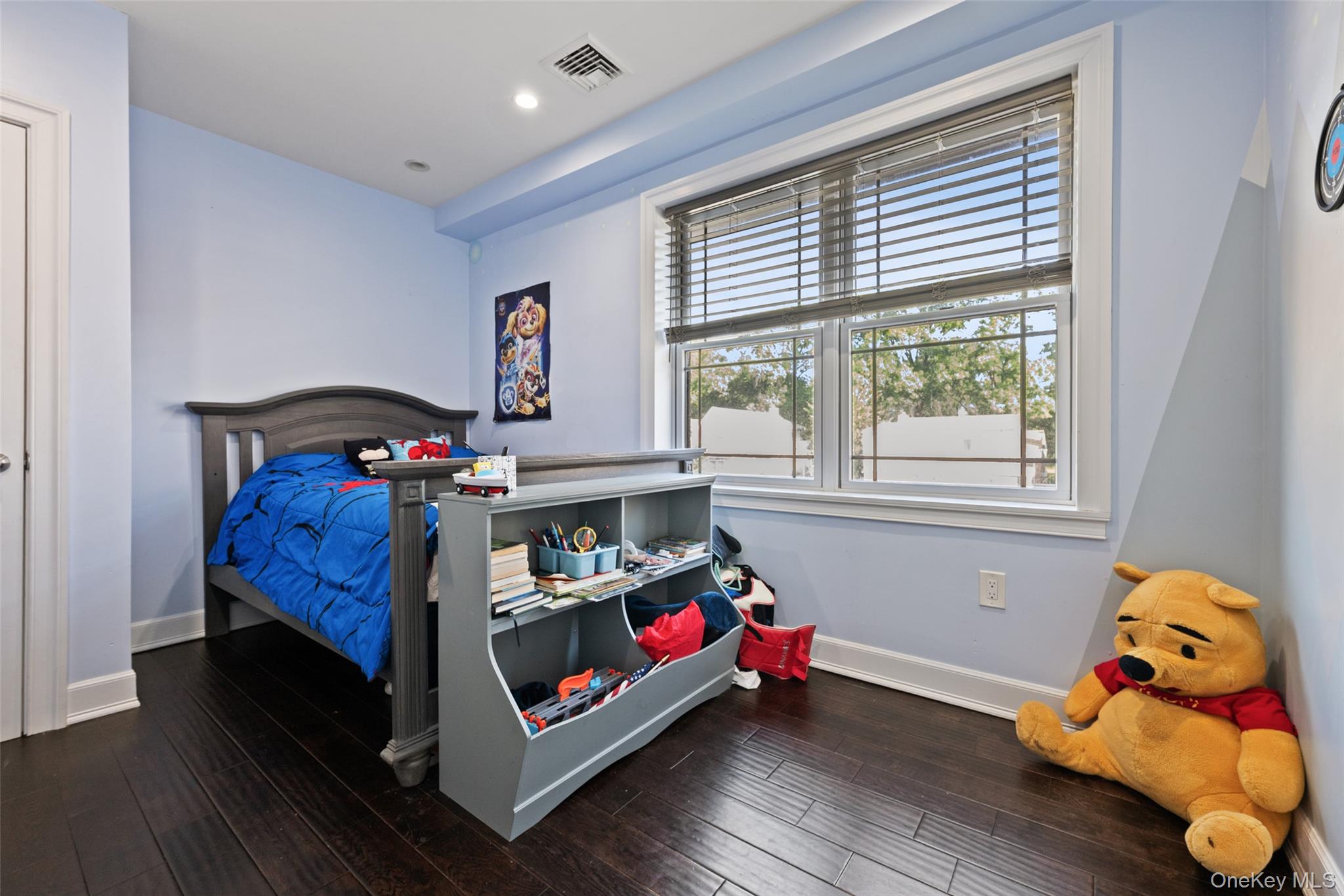 2063 Narragansett Avenue, Unit 2 Bronx, NY 10461 - Photo 9 of 37 Bedroom with dark wood-style floors and recessed lighting