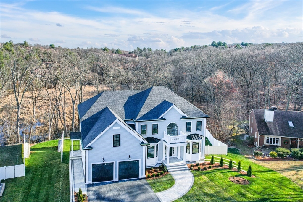 7 Crossman Road Woburn, MA 01801 - Photo 3 of 42 a view of a yard in front of house