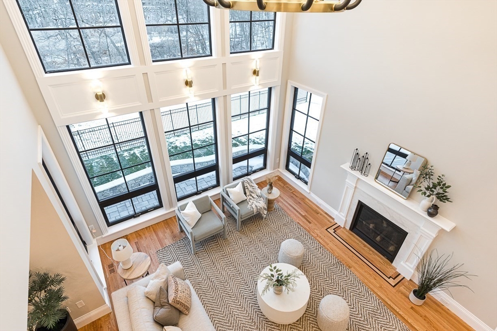 7 Crossman Road Woburn, MA 01801 - Photo 36 of 42 a living room with furniture fireplace and a large window