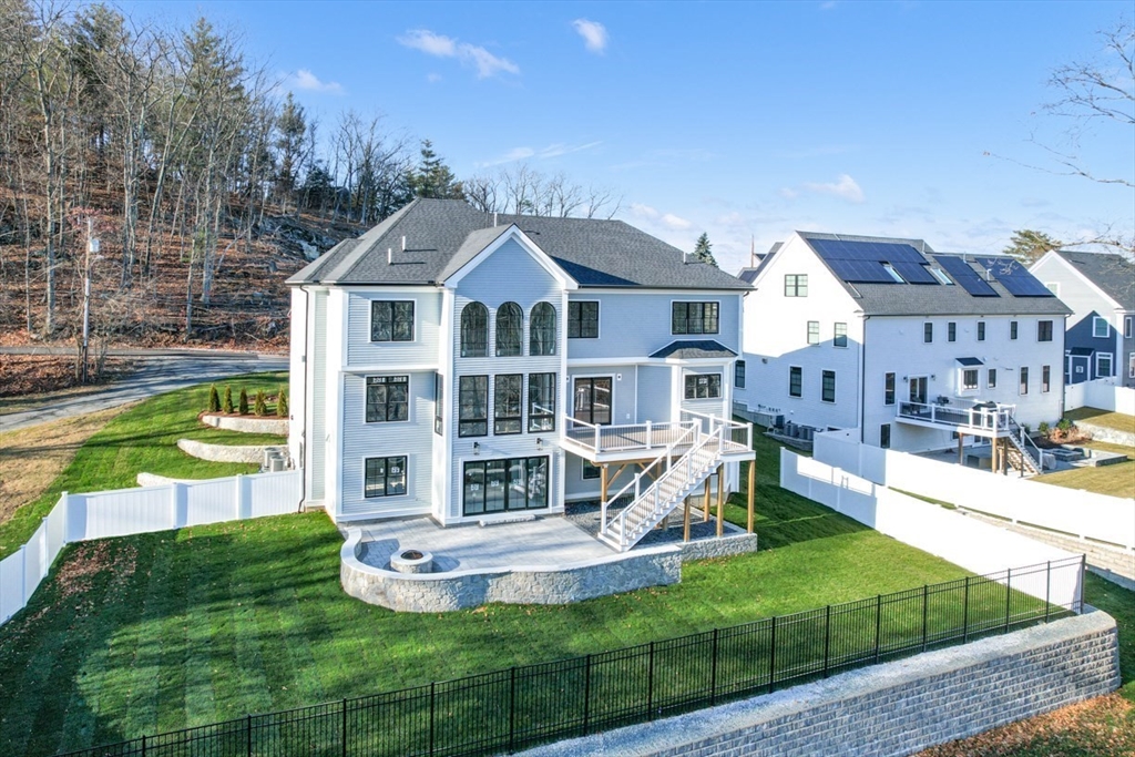 7 Crossman Road Woburn, MA 01801 - Photo 4 of 42 a view of a house with a yard porch and sitting area