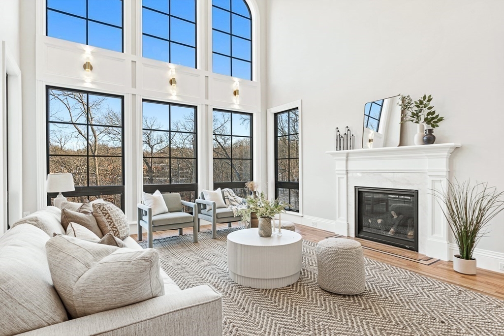 7 Crossman Road Woburn, MA 01801 - Photo 5 of 42 a living room with furniture and a fireplace