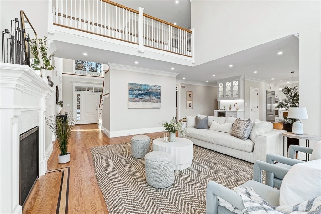 7 Crossman Road Woburn, MA 01801 - Photo 6 of 42 a living room with furniture and a fireplace