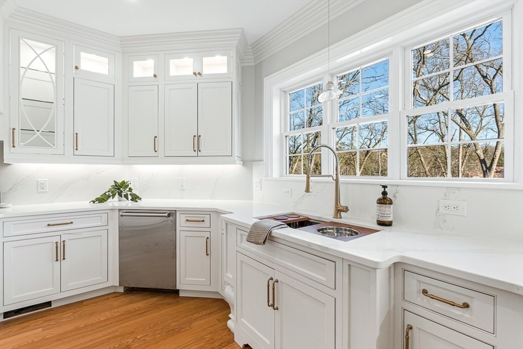7 Crossman Road Woburn, MA 01801 - Photo 10 of 42 a kitchen with cabinets appliances and a window
