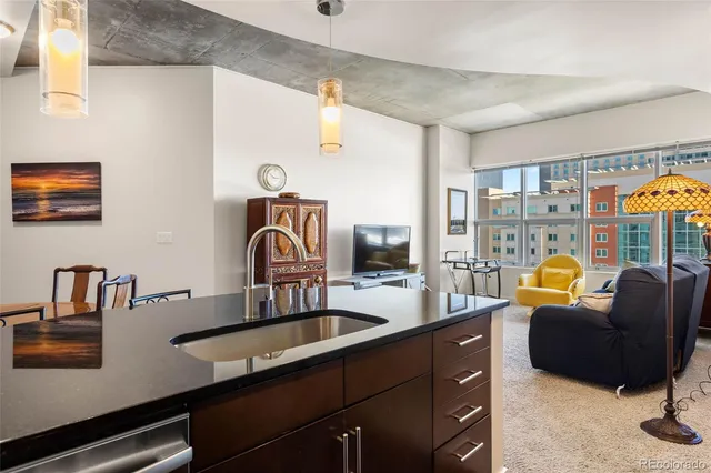 a kitchen with a sink and a refrigerator