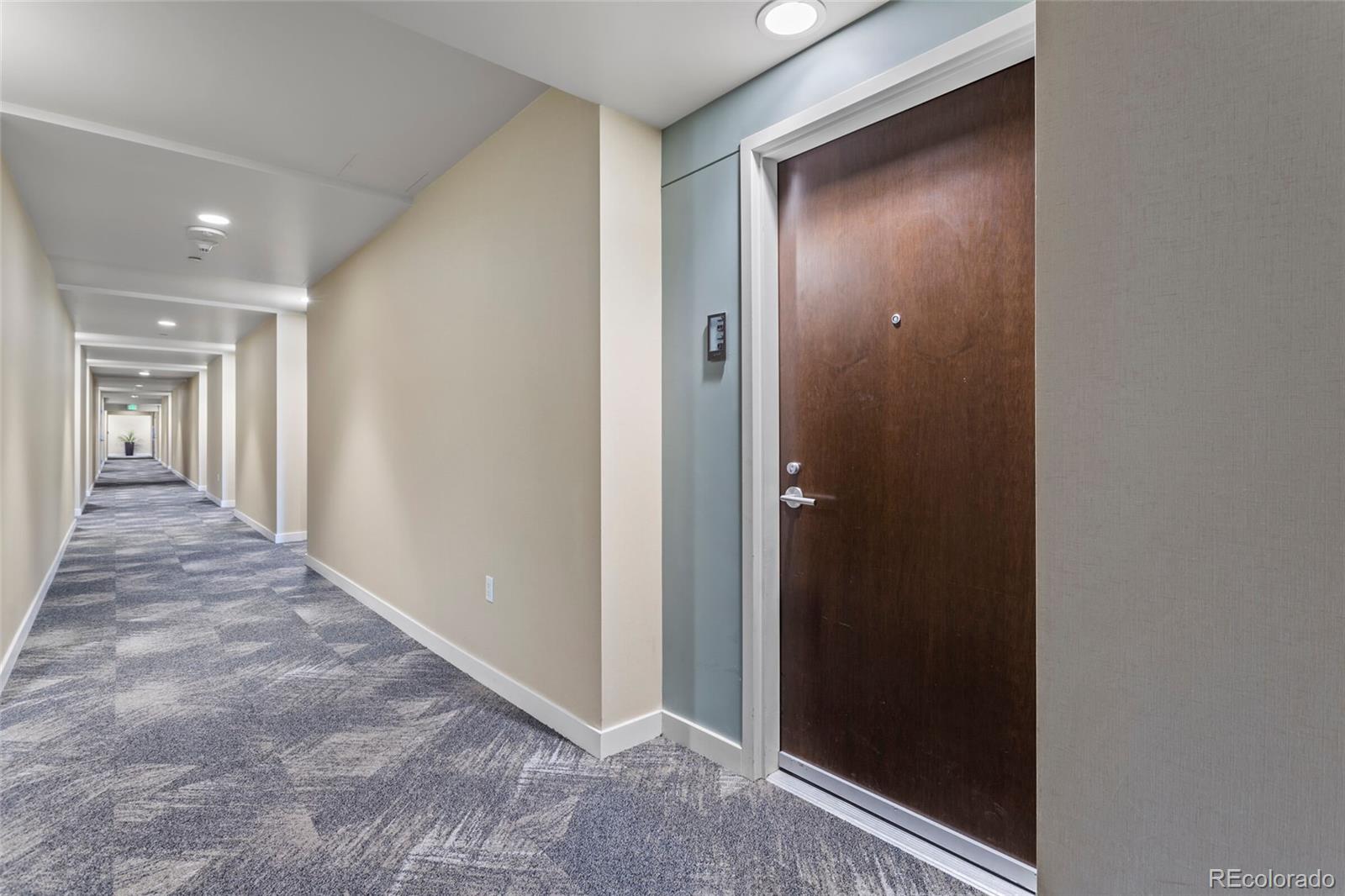 891 14th Street, Unit 1916 Denver, CO 80202 - Photo 2 of 33 a view of a hallway with wooden floor