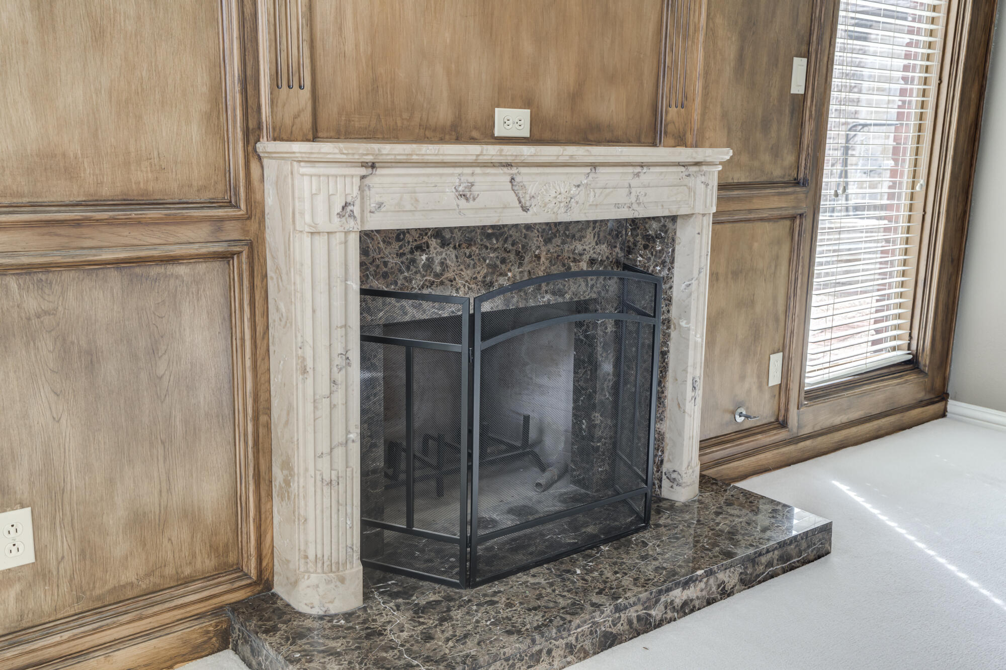 8902 York Place Lubbock, TX 79424 - Photo 11 of 54 a view of a livingroom with a fireplace and window