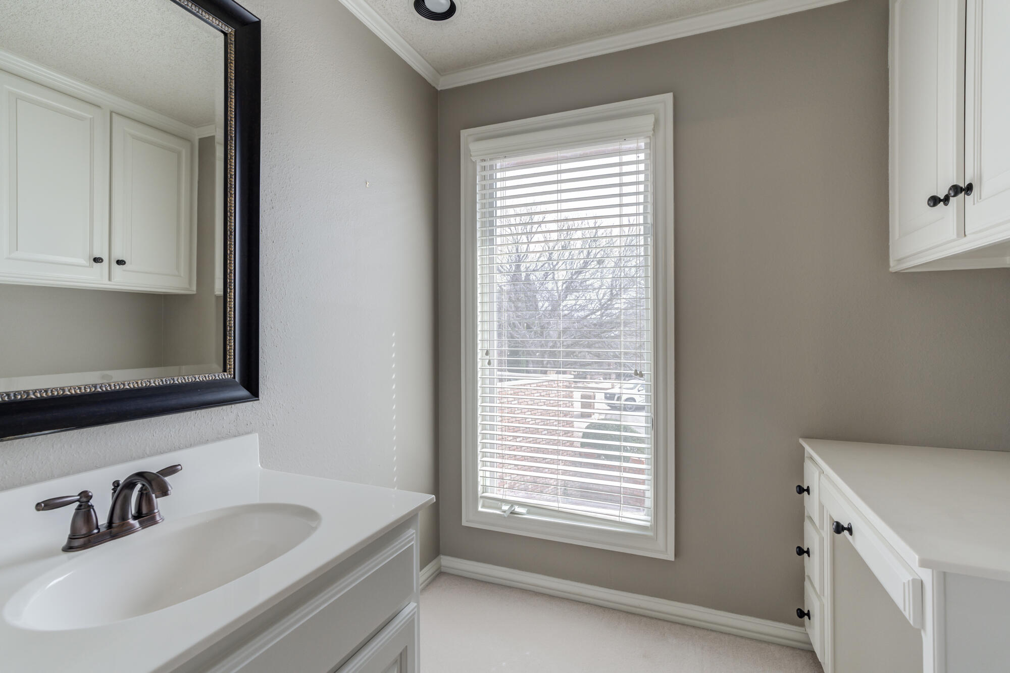 8902 York Place Lubbock, TX 79424 - Photo 42 of 54 a bathroom with a sink and a vanity