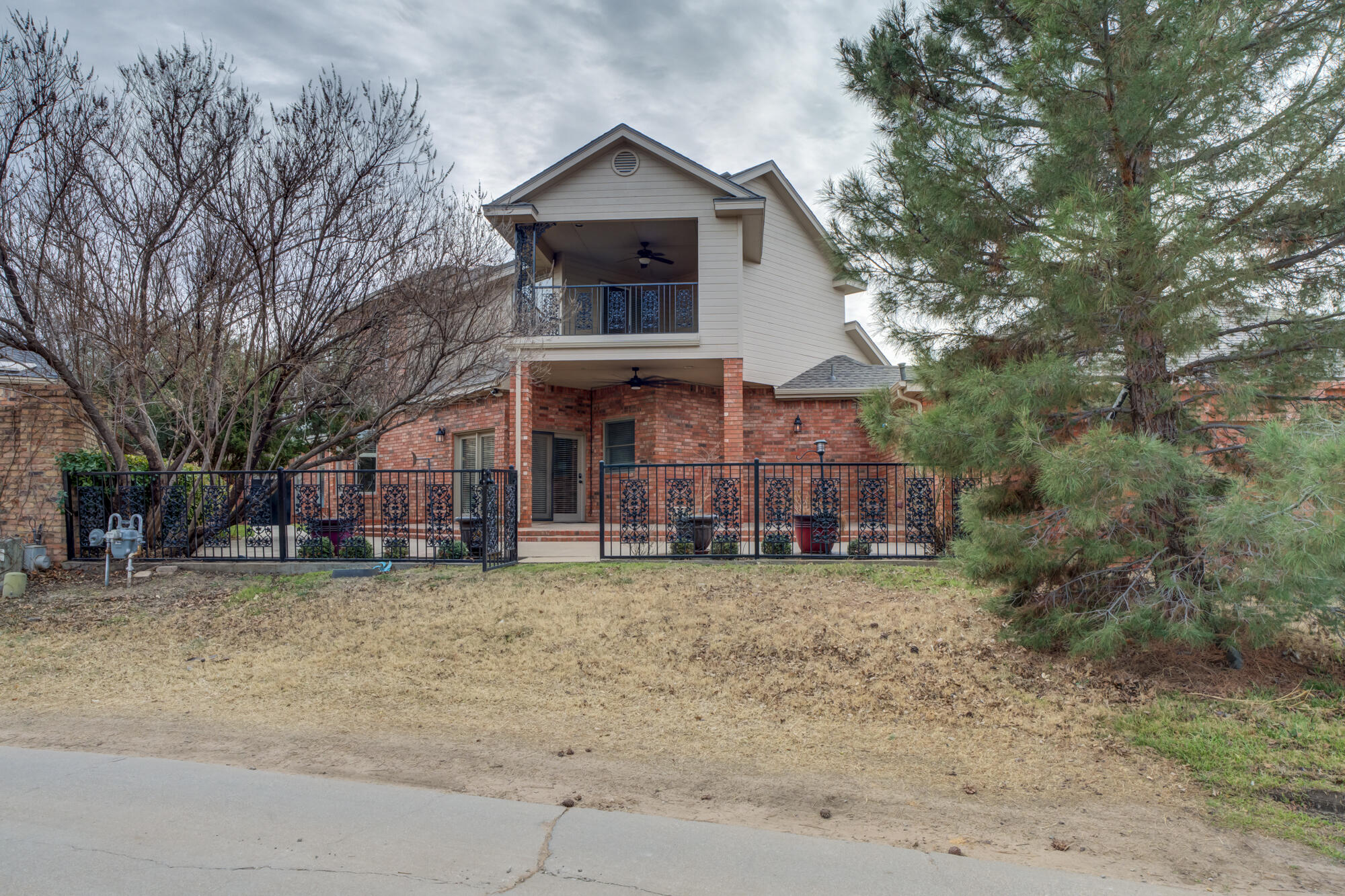 8902 York Place Lubbock, TX 79424 - Photo 53 of 54 a view of a house with a yard and large trees