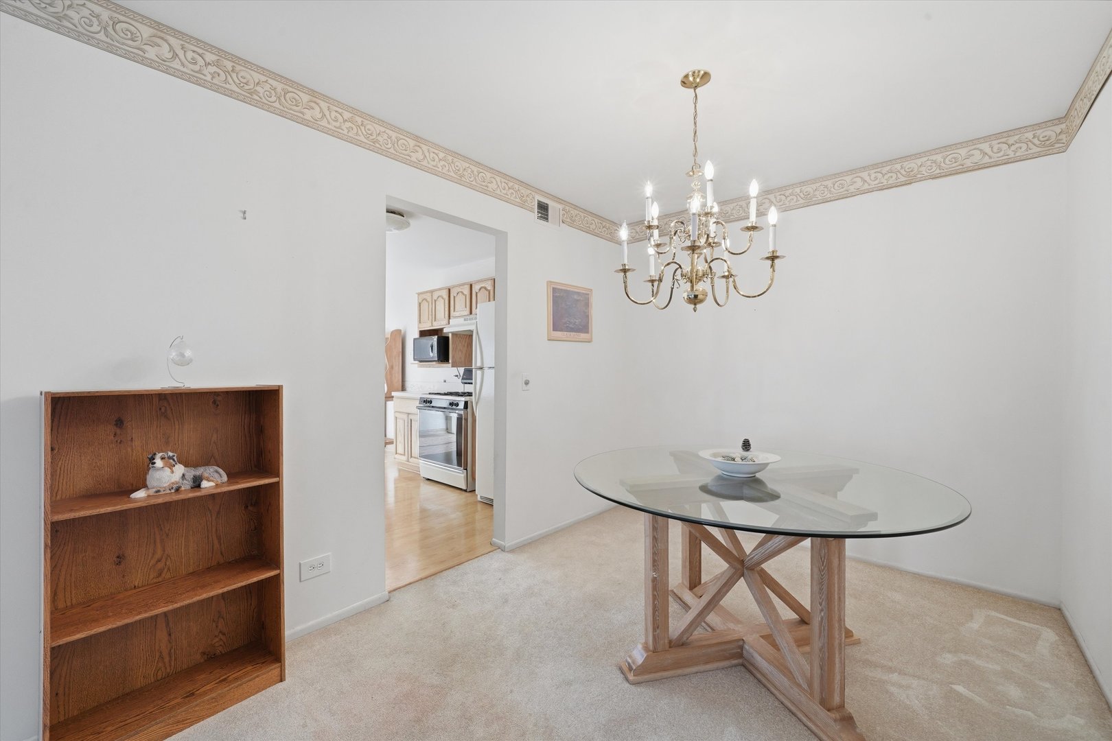 1220 Plum Tree Court, Unit 2D Schaumburg, IL 60193 - Photo 7 of 24 a view of a chandelier in a room