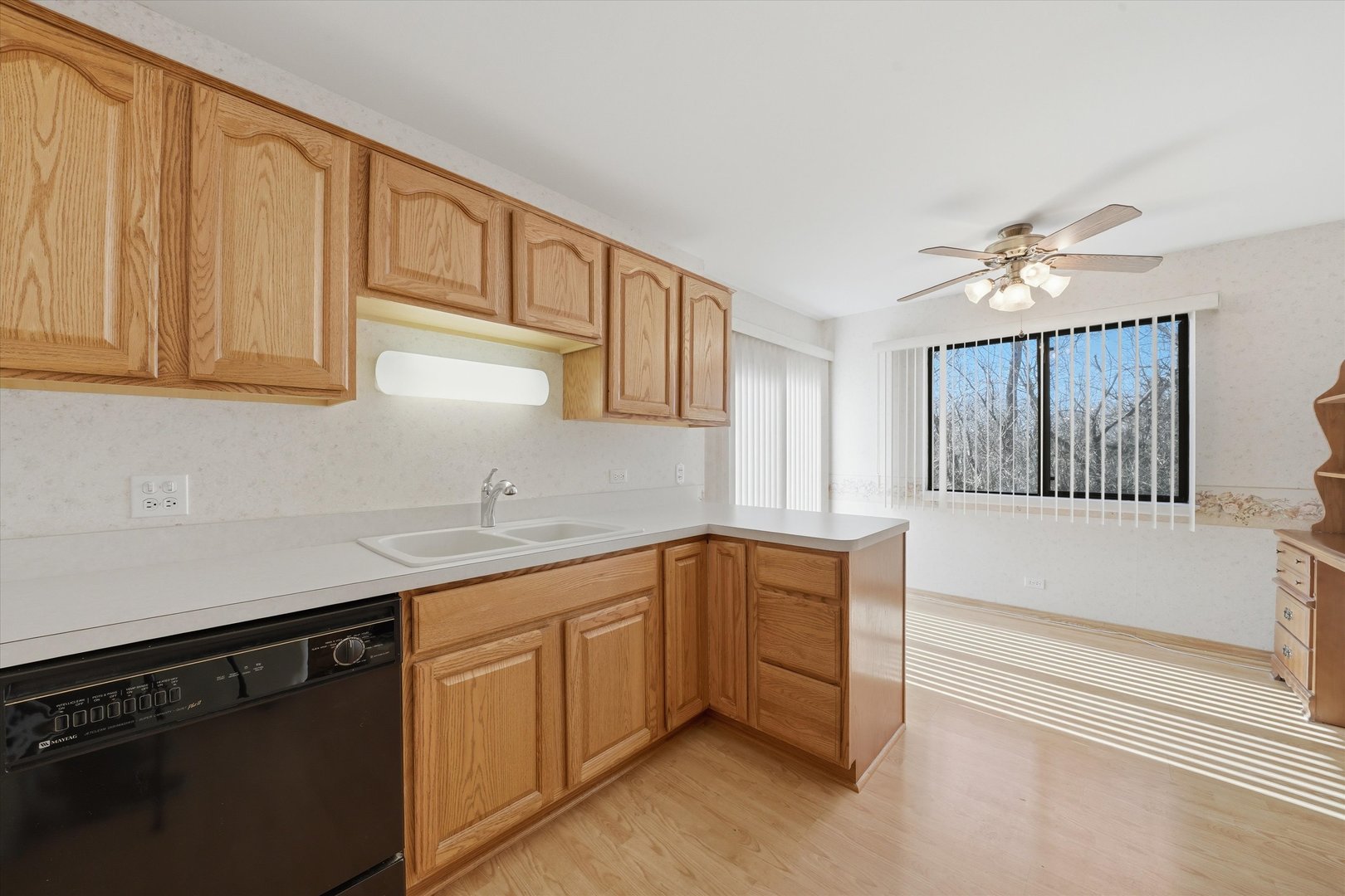 1220 Plum Tree Court, Unit 2D Schaumburg, IL 60193 - Photo 8 of 24 a kitchen with a sink dishwasher and cabinets
