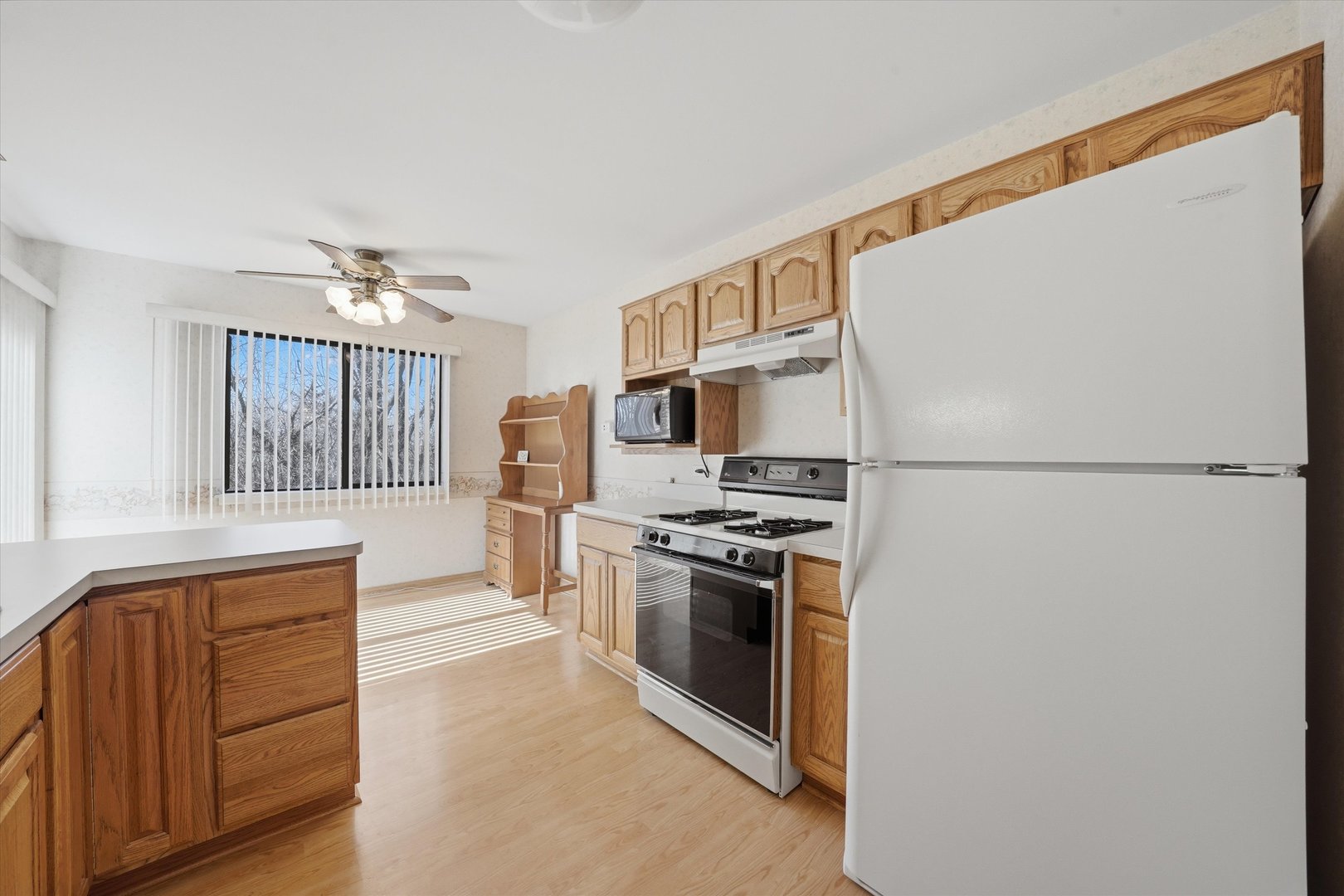 1220 Plum Tree Court, Unit 2D Schaumburg, IL 60193 - Photo 9 of 24 a kitchen with stainless steel appliances granite countertop a refrigerator a stove a sink and a microwave
