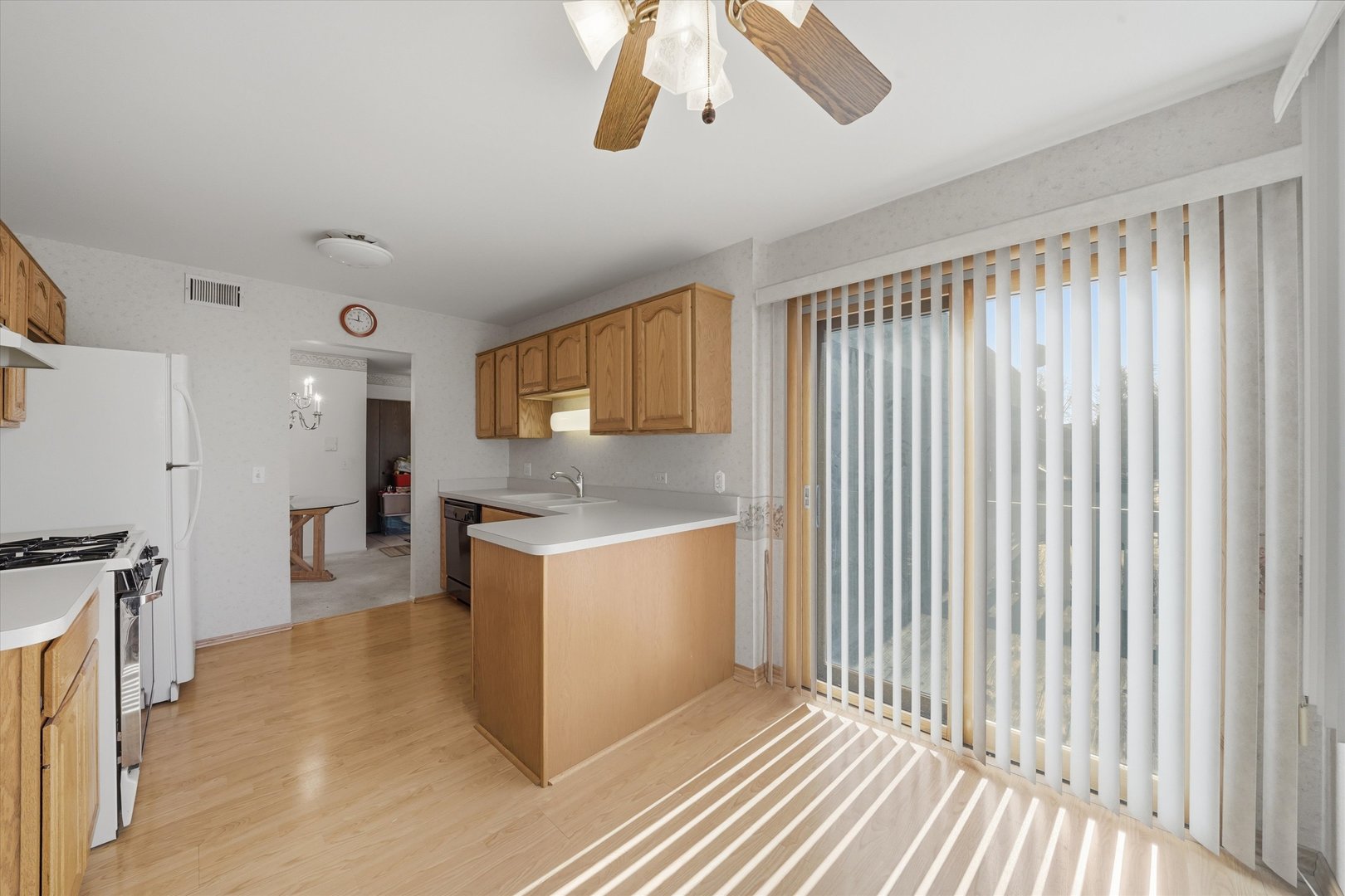 1220 Plum Tree Court, Unit 2D Schaumburg, IL 60193 - Photo 10 of 24 a kitchen with stainless steel appliances granite countertop cabinets and wooden floor
