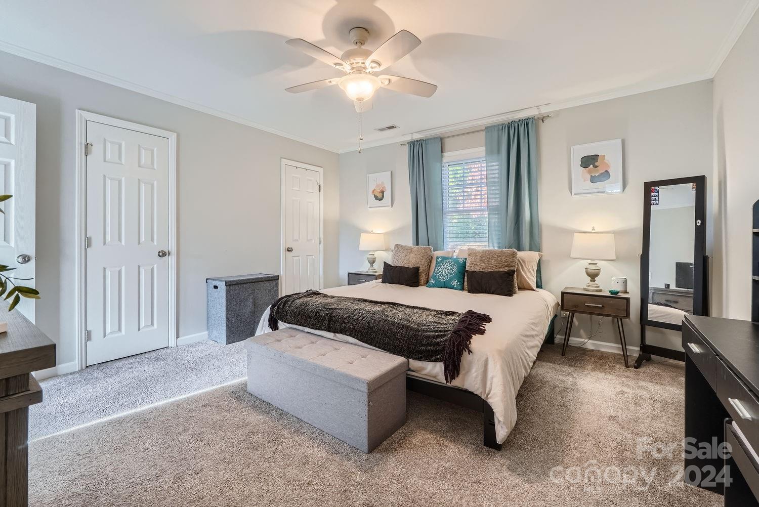 11111 Graybark Road Midland, NC 28107 - Photo 14 of 37 a bed room with a bed and a chandelier