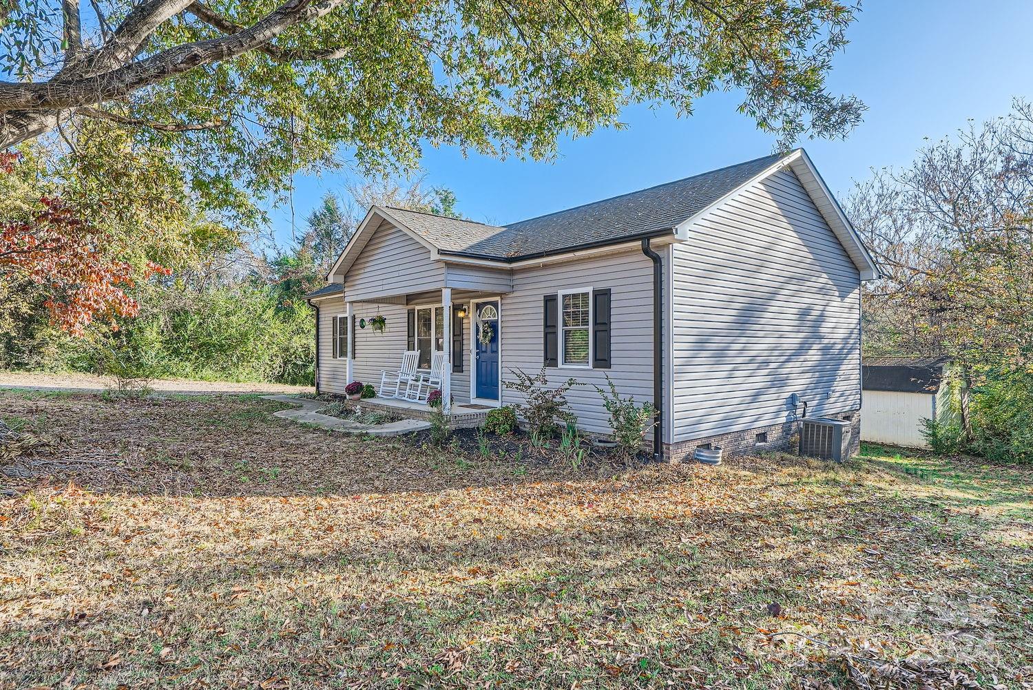 11111 Graybark Road Midland, NC 28107 - Photo 2 of 37 a view of a house with a yard and large tree