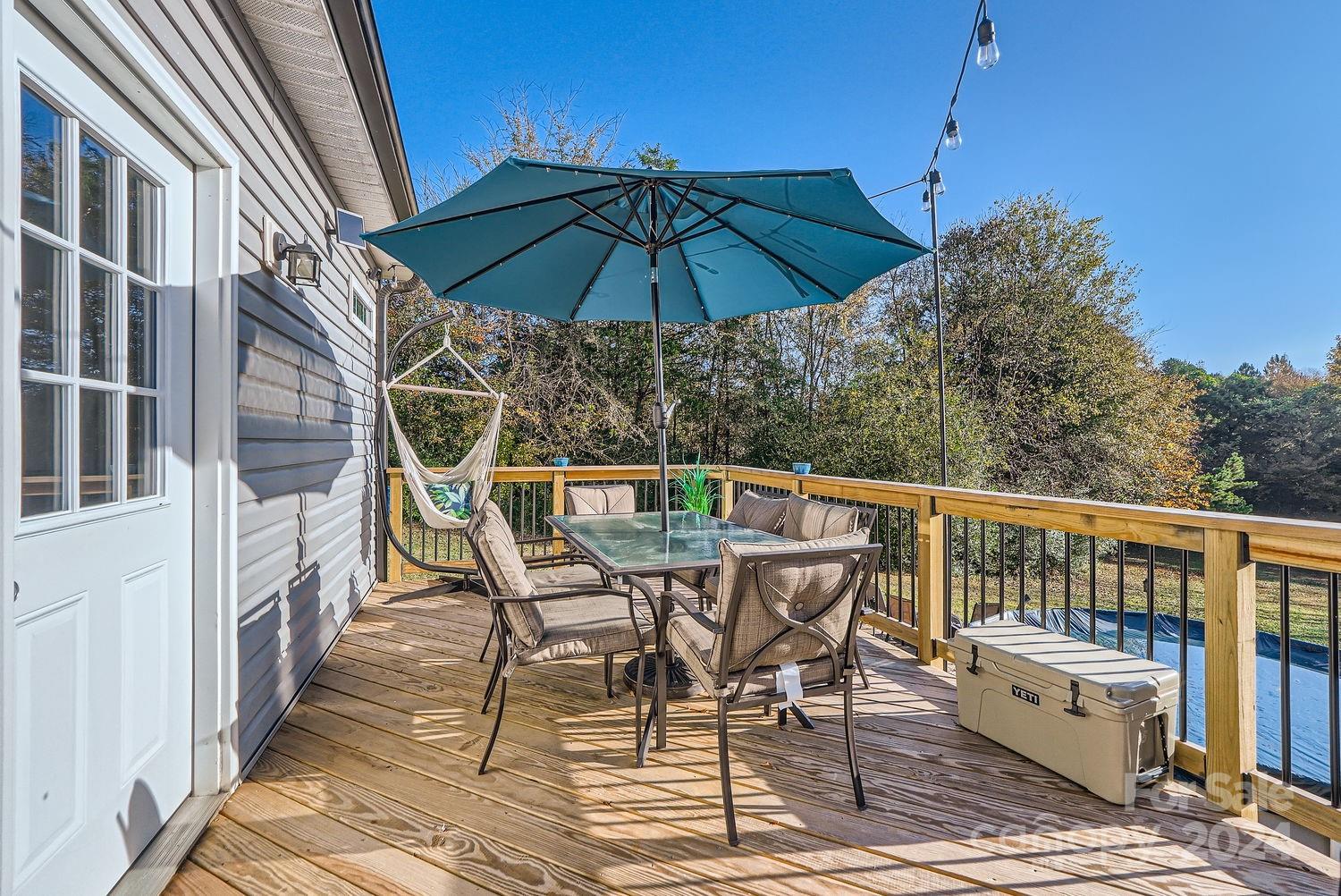 11111 Graybark Road Midland, NC 28107 - Photo 24 of 37 a view of balcony with outdoor seating and wooden floor