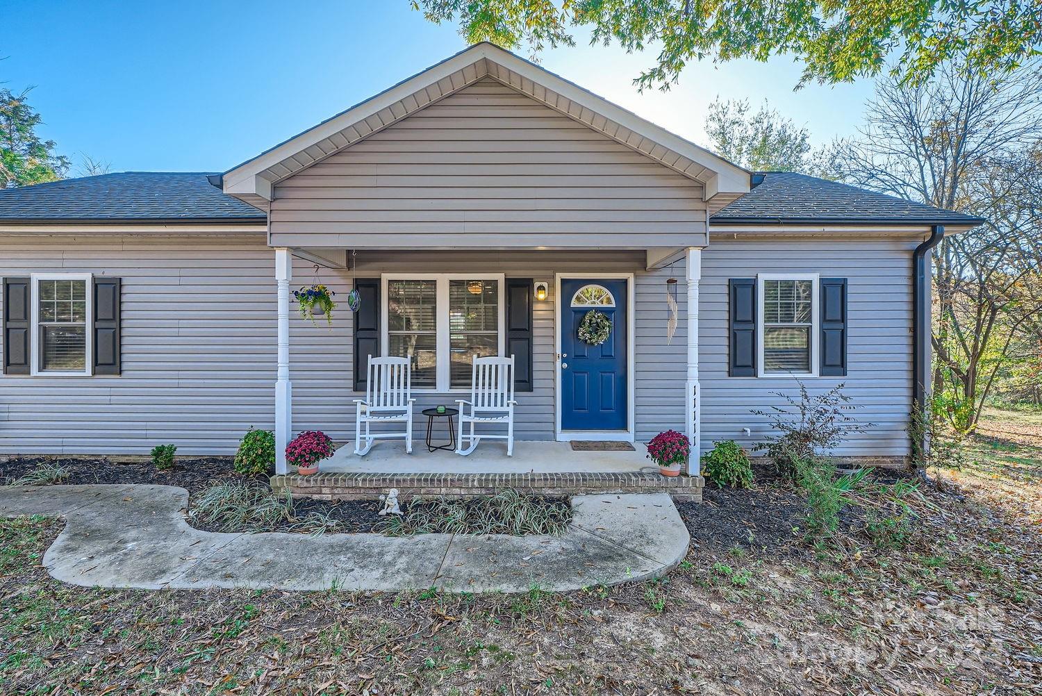 11111 Graybark Road Midland, NC 28107 - Photo 31 of 37 a front view of a house with garden