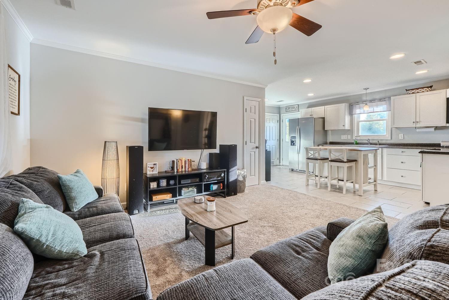 11111 Graybark Road Midland, NC 28107 - Photo 5 of 37 a living room with furniture and a flat screen tv