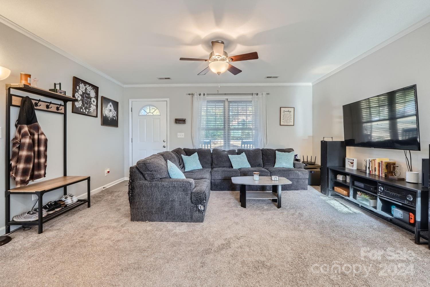 11111 Graybark Road Midland, NC 28107 - Photo 8 of 37 a living room with furniture and a flat screen tv
