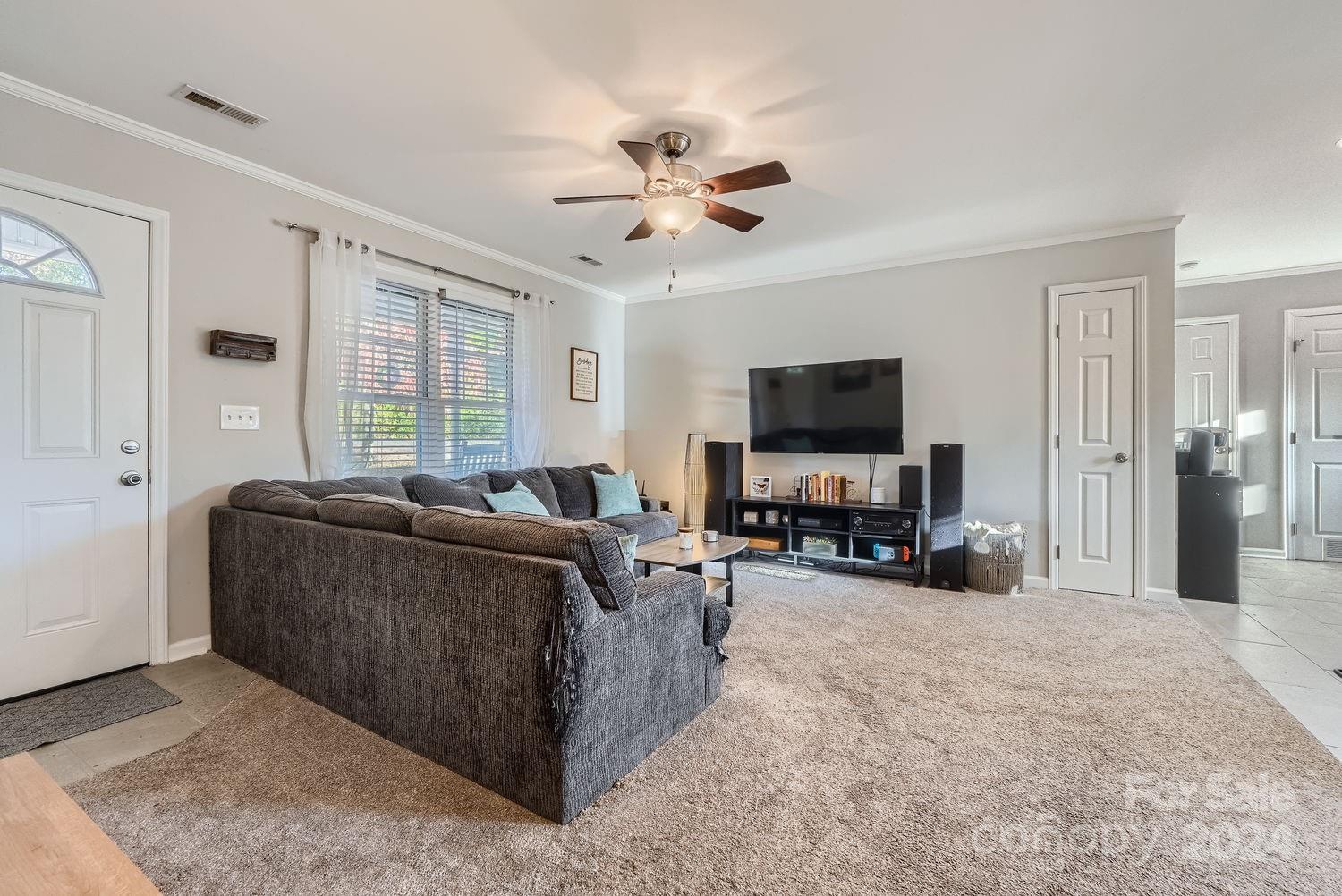 11111 Graybark Road Midland, NC 28107 - Photo 9 of 37 a living room with furniture and a flat screen tv