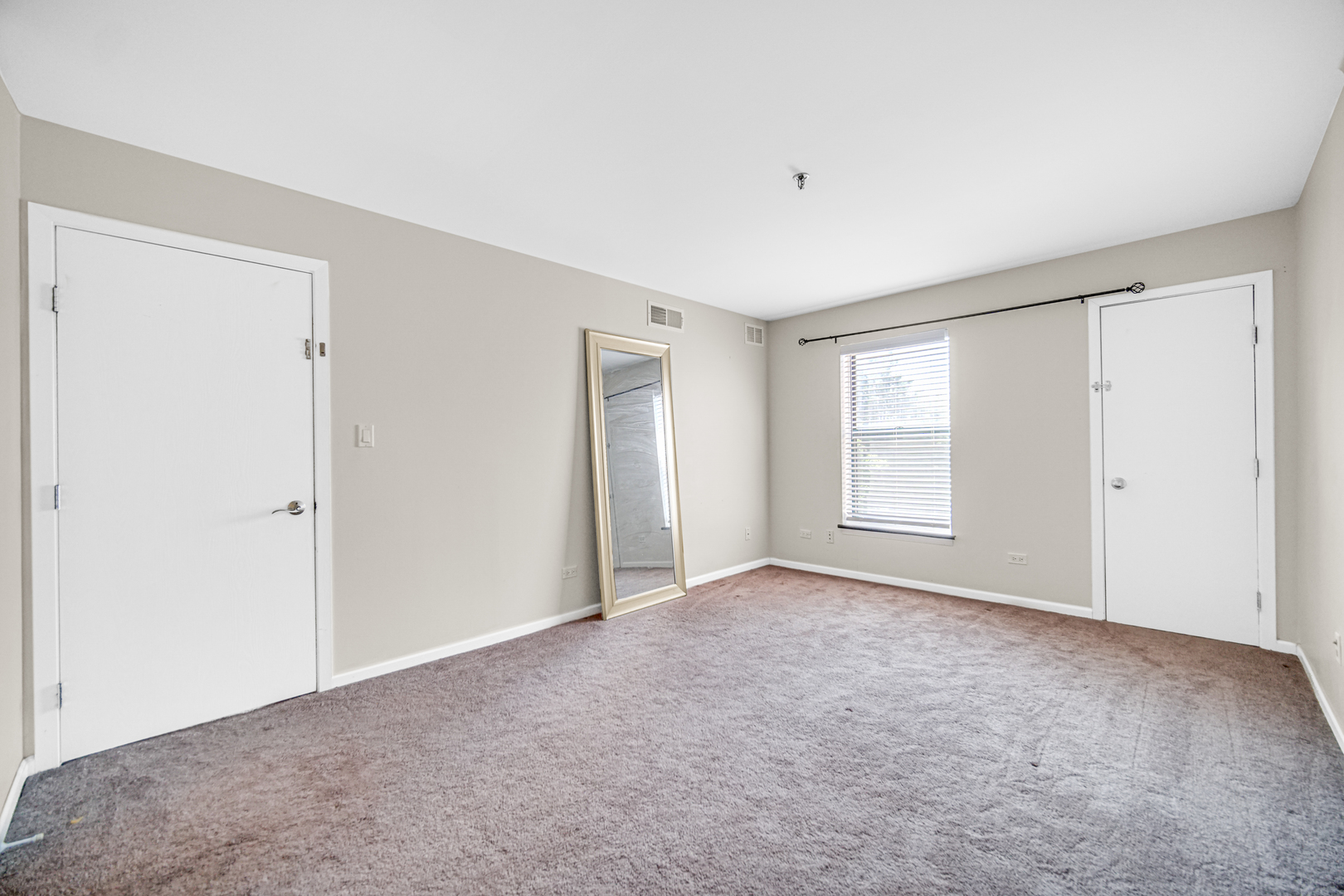 3255 Kirchoff Road, Unit 312 Rolling Meadows, IL 60008 - Photo 12 of 22 a view of an empty room with a window