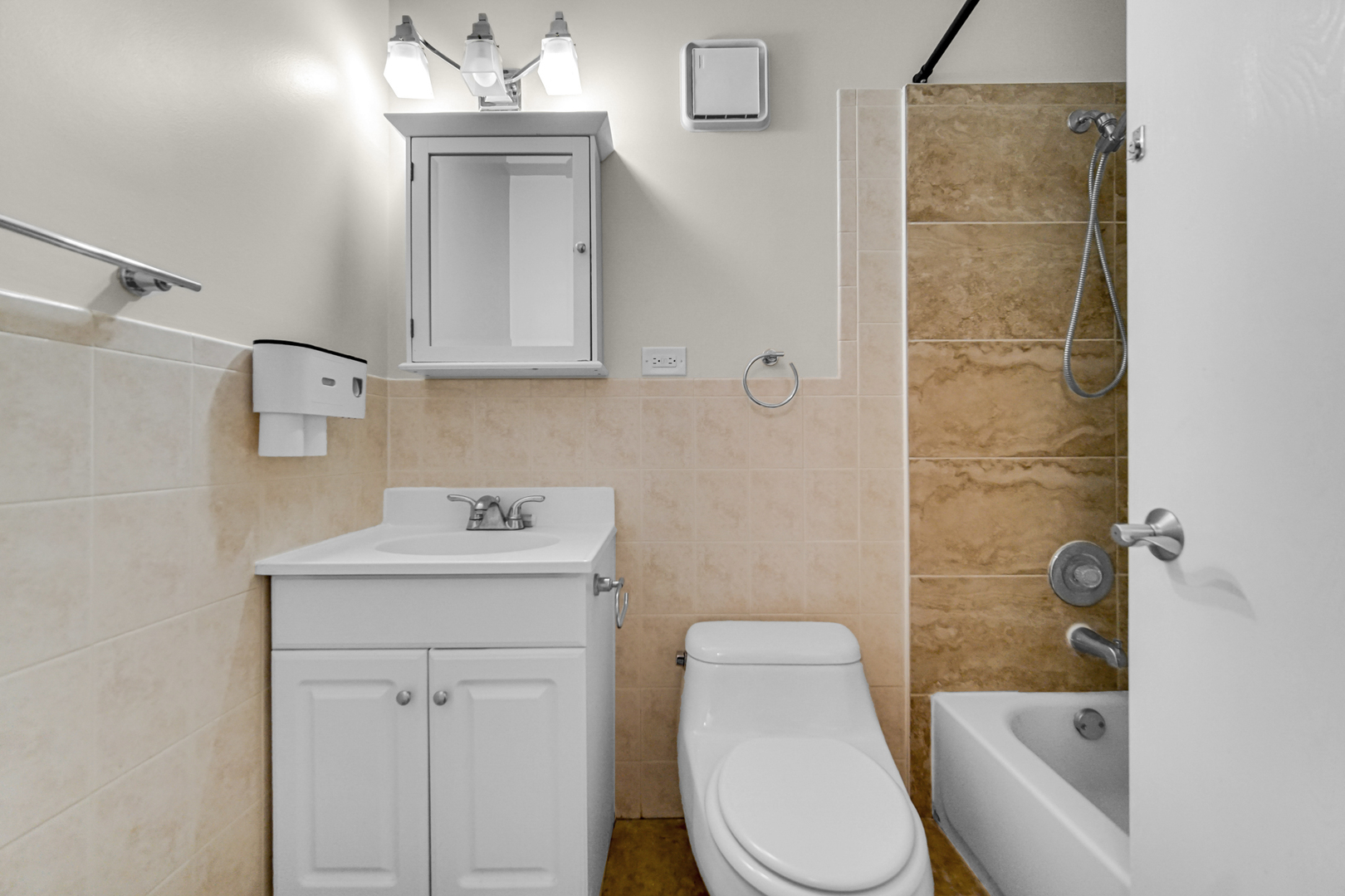 3255 Kirchoff Road, Unit 312 Rolling Meadows, IL 60008 - Photo 13 of 22 a bathroom with a sink a toilet and shower