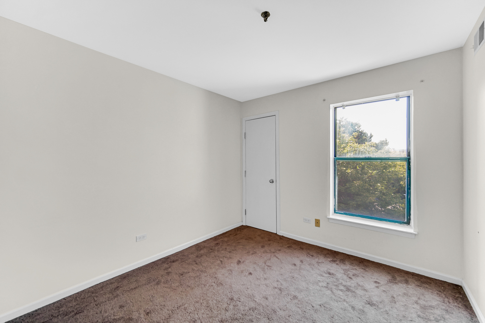 3255 Kirchoff Road, Unit 312 Rolling Meadows, IL 60008 - Photo 15 of 22 an empty room with a window