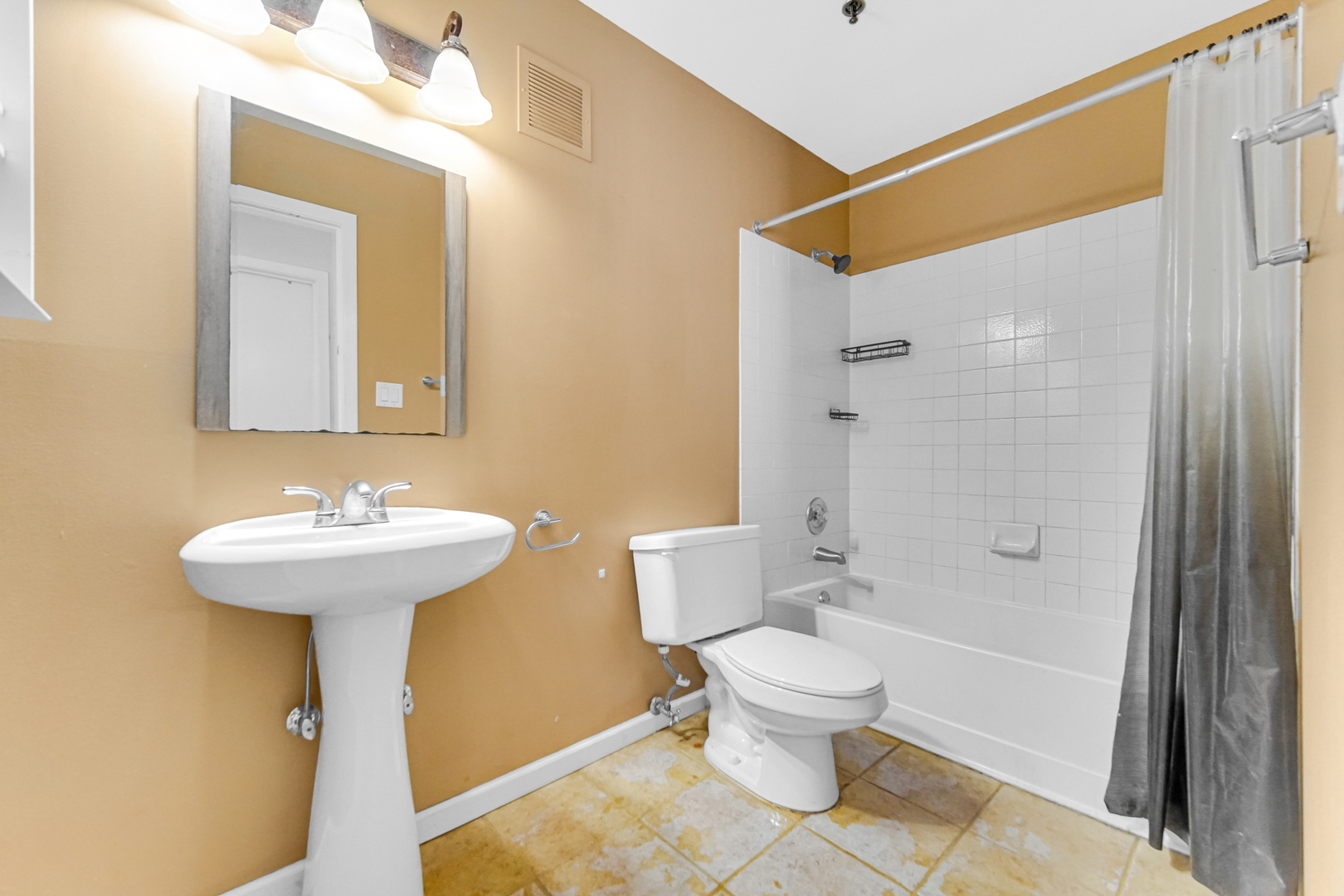 3255 Kirchoff Road, Unit 312 Rolling Meadows, IL 60008 - Photo 16 of 22 a bathroom with a sink a toilet and shower