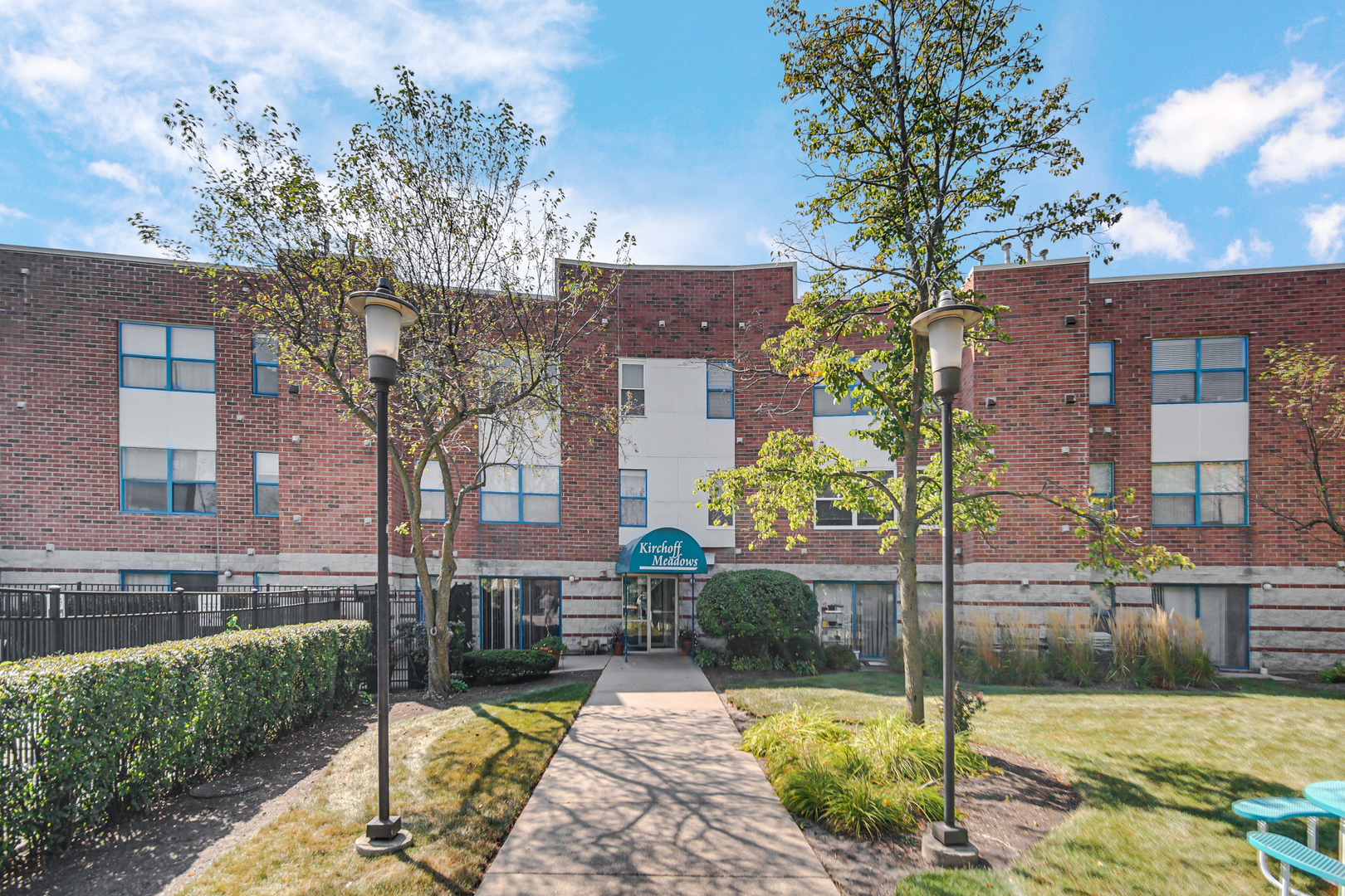 3255 Kirchoff Road, Unit 312 Rolling Meadows, IL 60008 - Photo 17 of 22 a view of a house with a yard