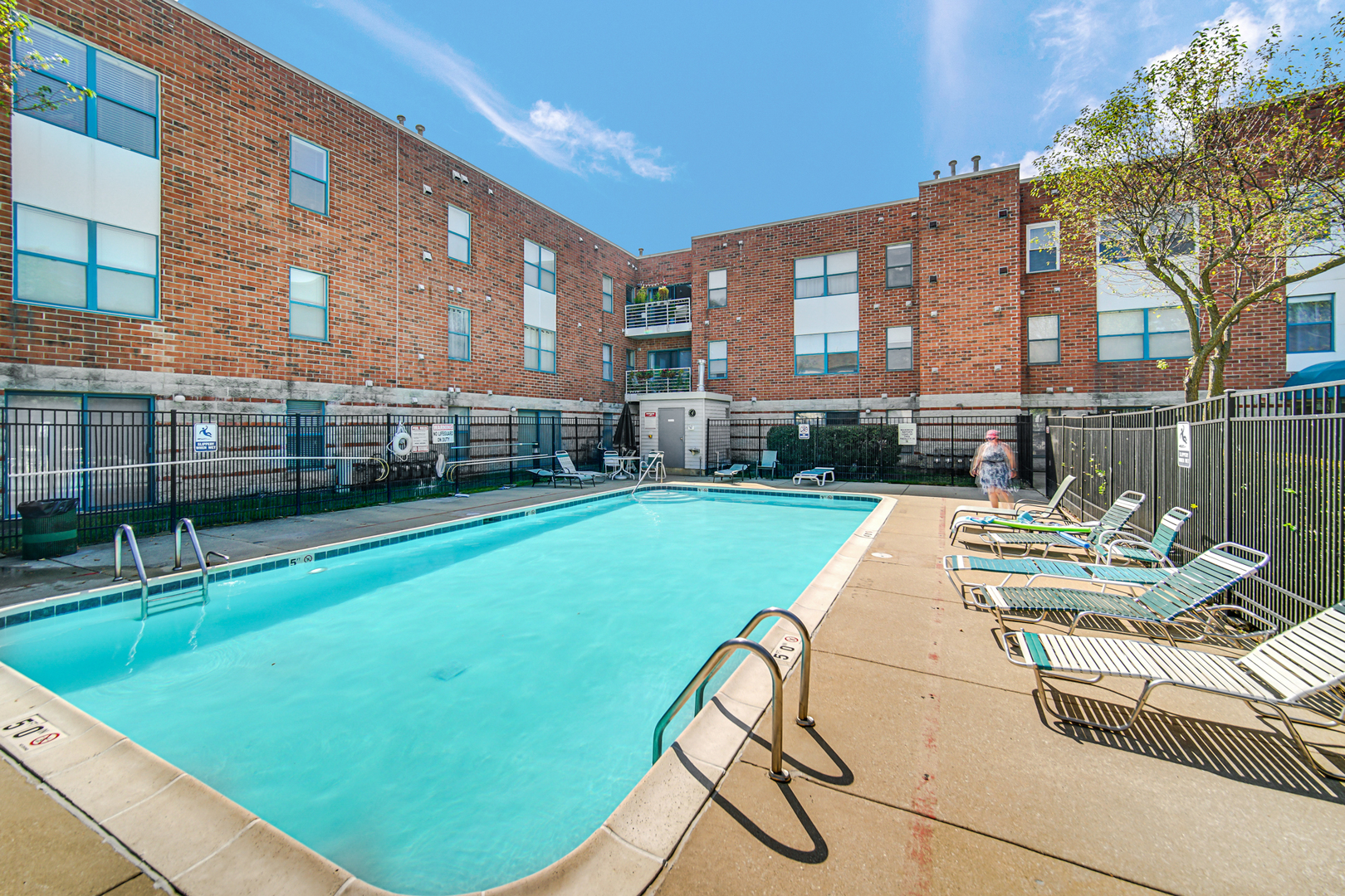 3255 Kirchoff Road, Unit 312 Rolling Meadows, IL 60008 - Photo 21 of 22 a view of a swimming pool with a lounge chairs