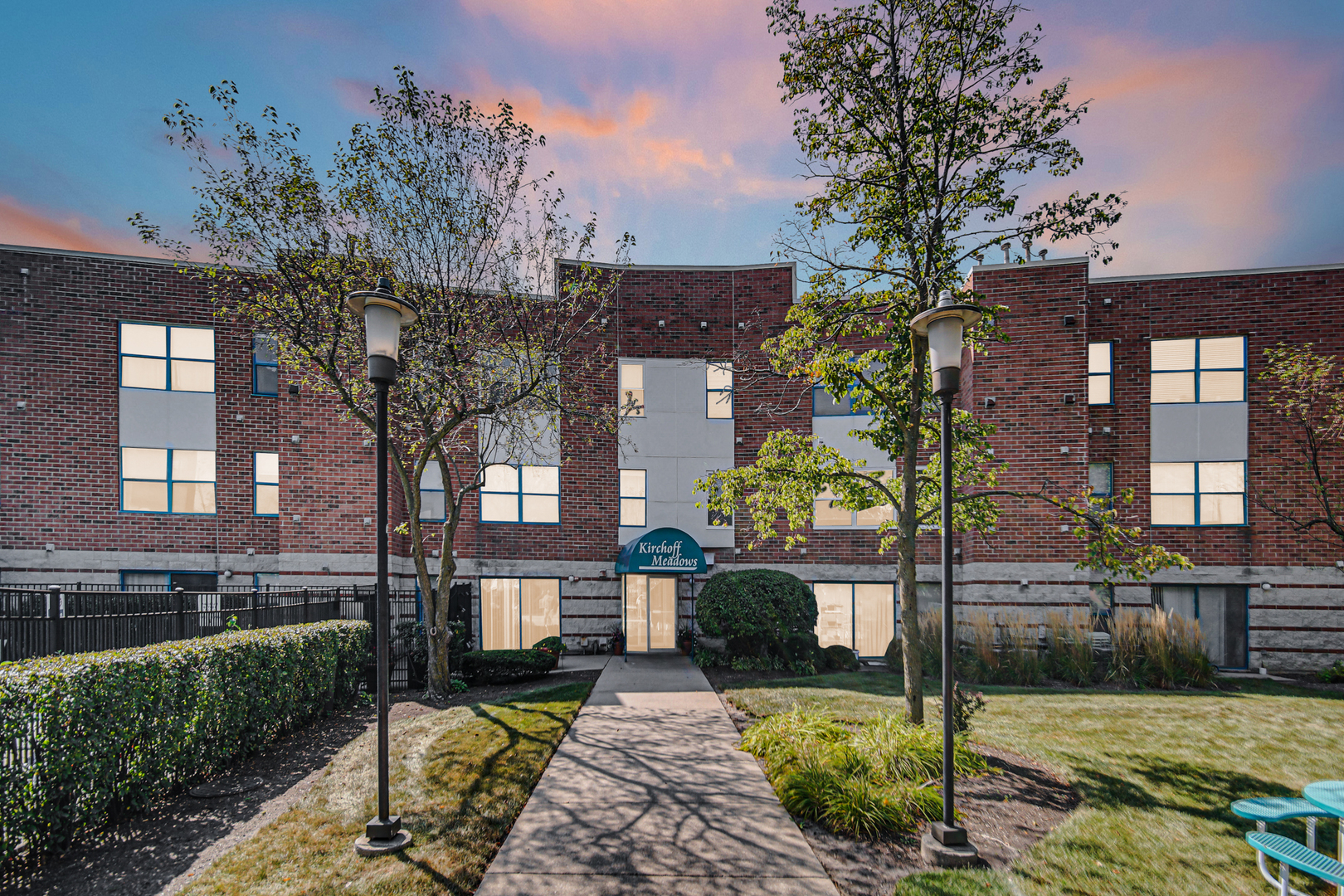 3255 Kirchoff Road, Unit 312 Rolling Meadows, IL 60008 - Photo 22 of 22 a front view of a house with garden