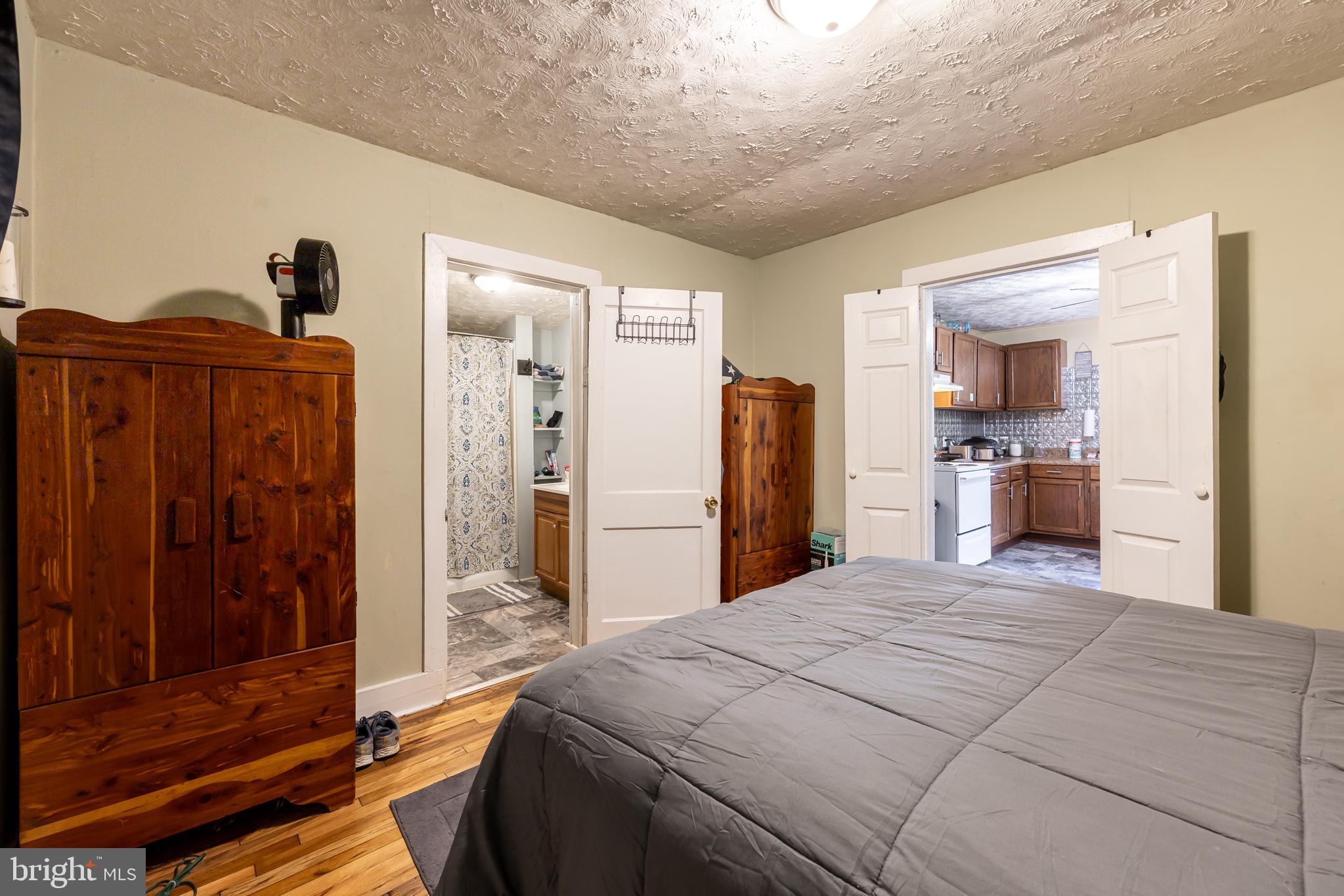 17227 Oakshade Road Orange, VA 22960 - Photo 11 of 19 a bedroom with a large bed and a dresser