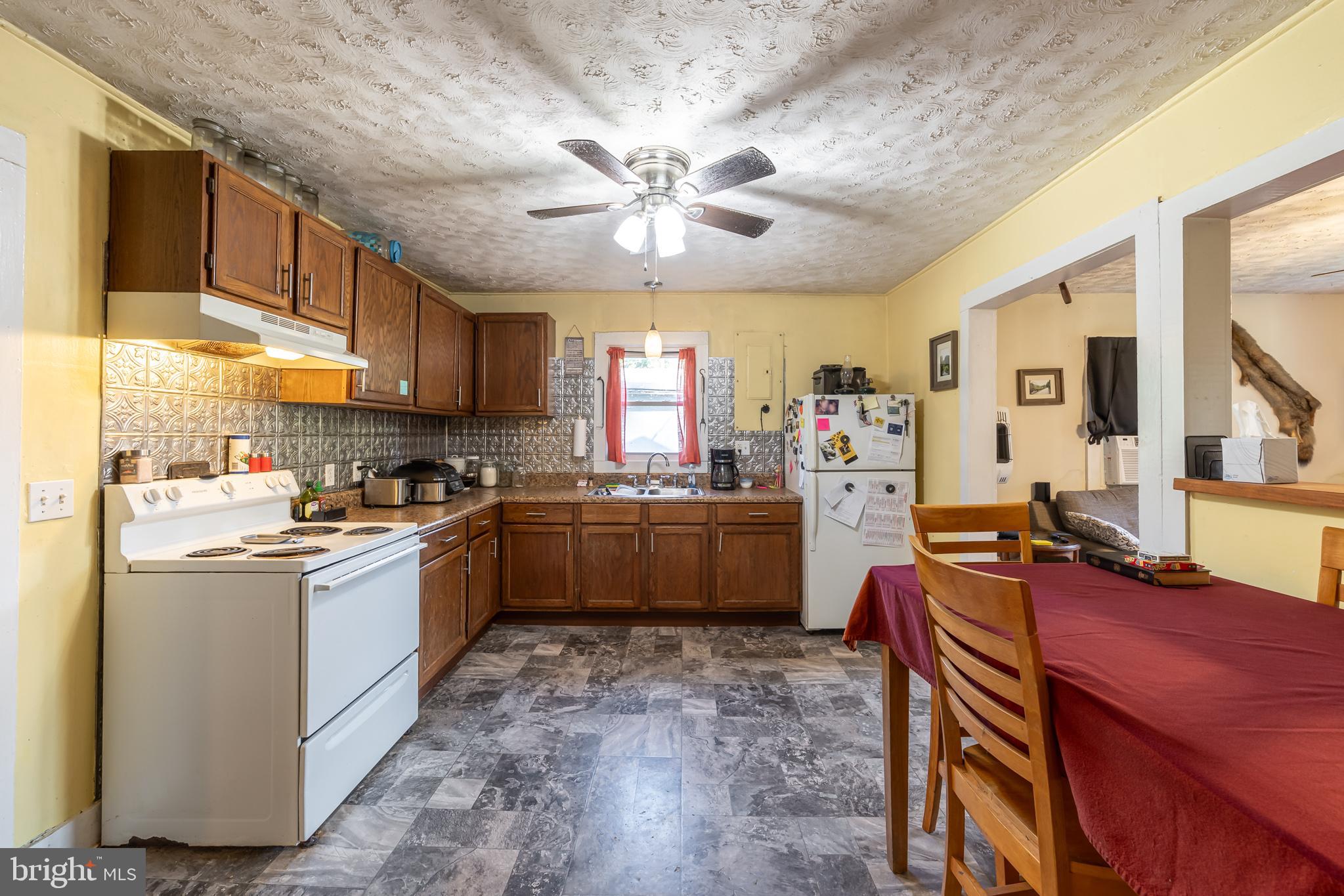 17227 Oakshade Road Orange, VA 22960 - Photo 5 of 19 a kitchen with stainless steel appliances granite countertop a sink stove and refrigerator