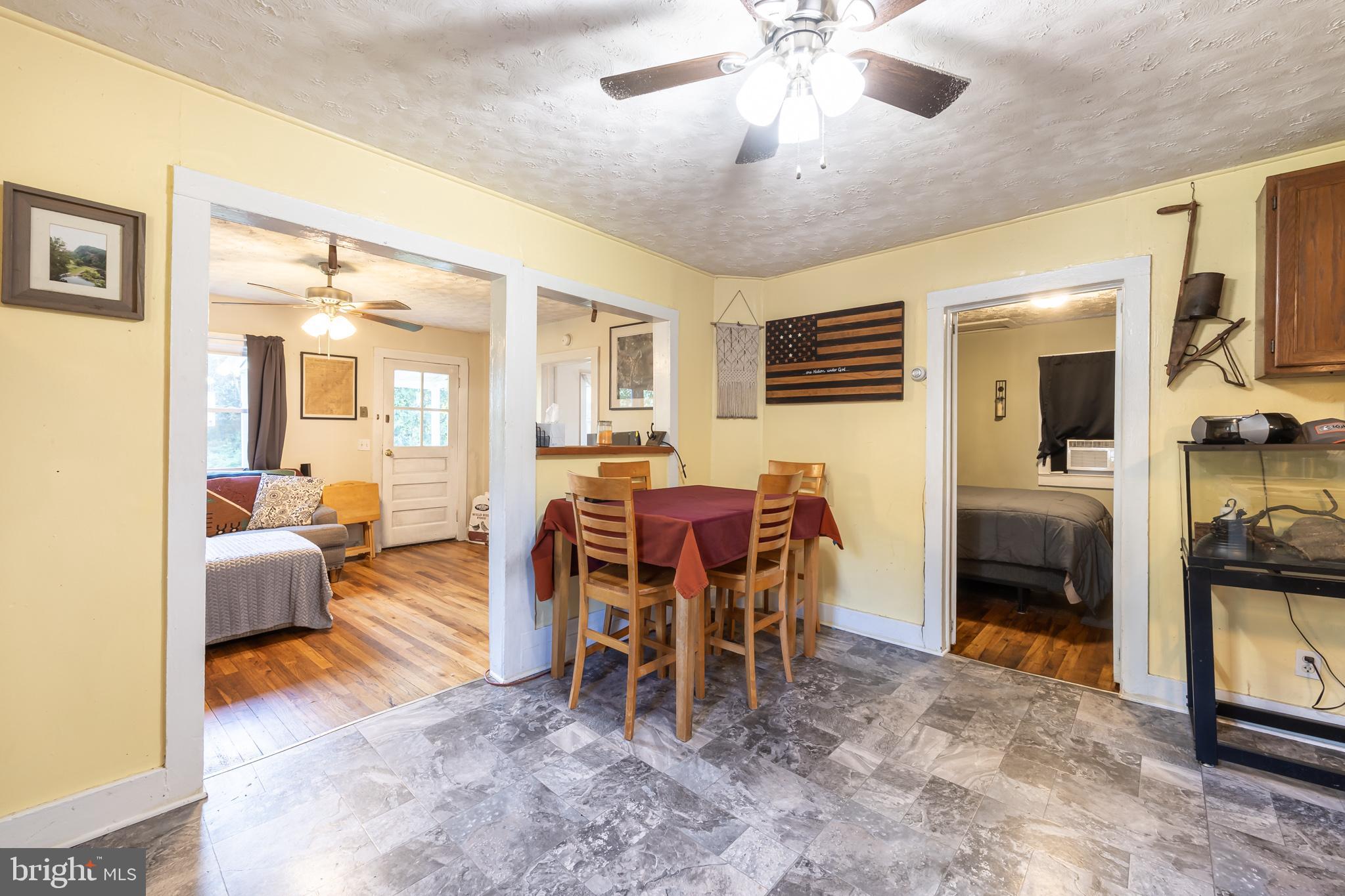 17227 Oakshade Road Orange, VA 22960 - Photo 7 of 19 a view of a livingroom with furniture and a flat screen tv