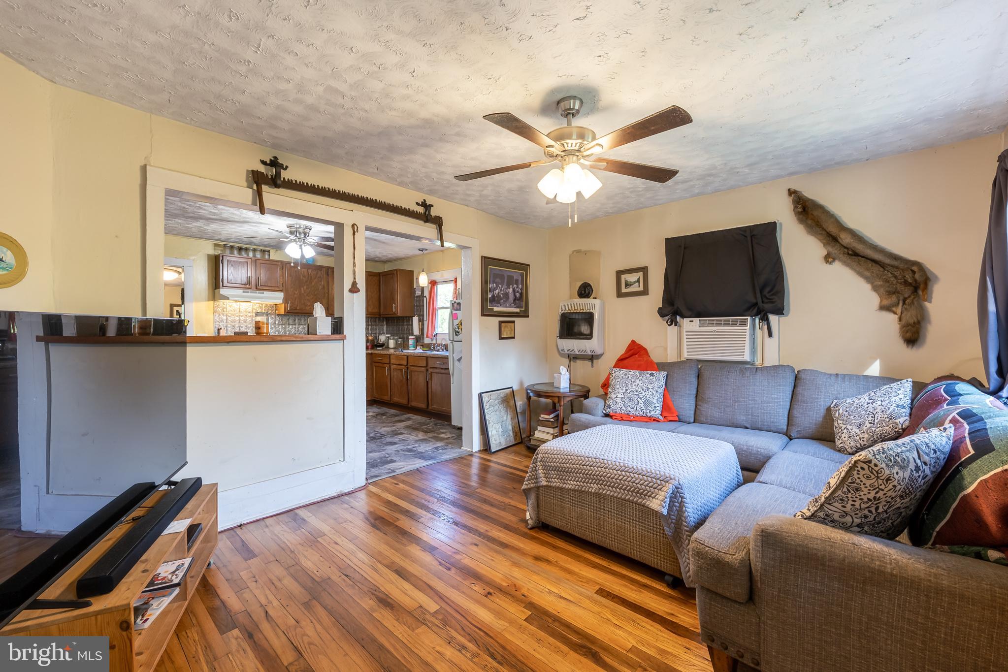 17227 Oakshade Road Orange, VA 22960 - Photo 9 of 19 a living room with furniture and a flat screen tv