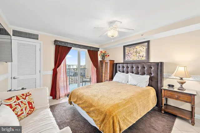 a bed room with a bed and painting on the wall