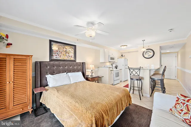 a bathroom with a granite countertop sink a toilet and a mirror