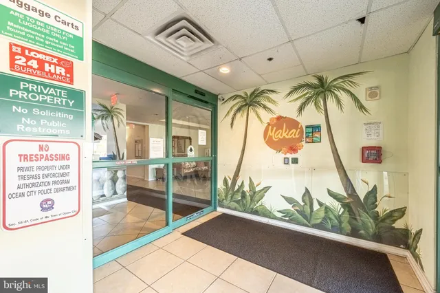 a living room with granite countertop furniture and kitchen view