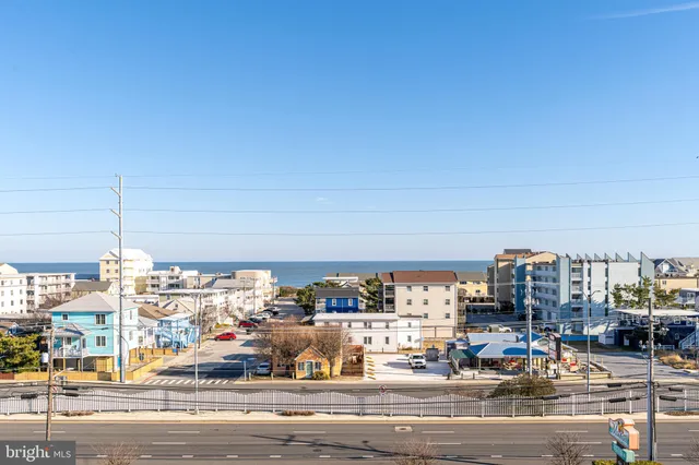 a lobby with furniture and a floor to ceiling window