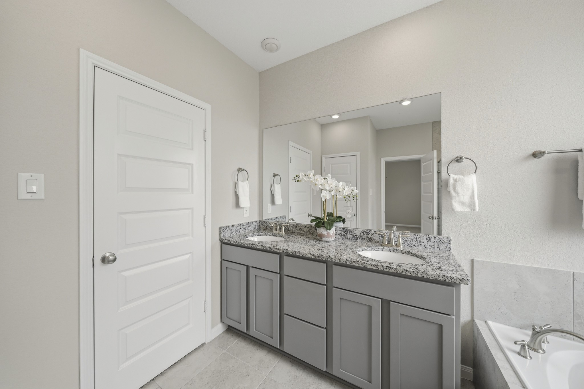 4103 Tranquil Square Road Houston, TX 77043 - Photo 23 of 39 A large mirror and recessed lights aid in getting your morning routines accomplished effortlessly.