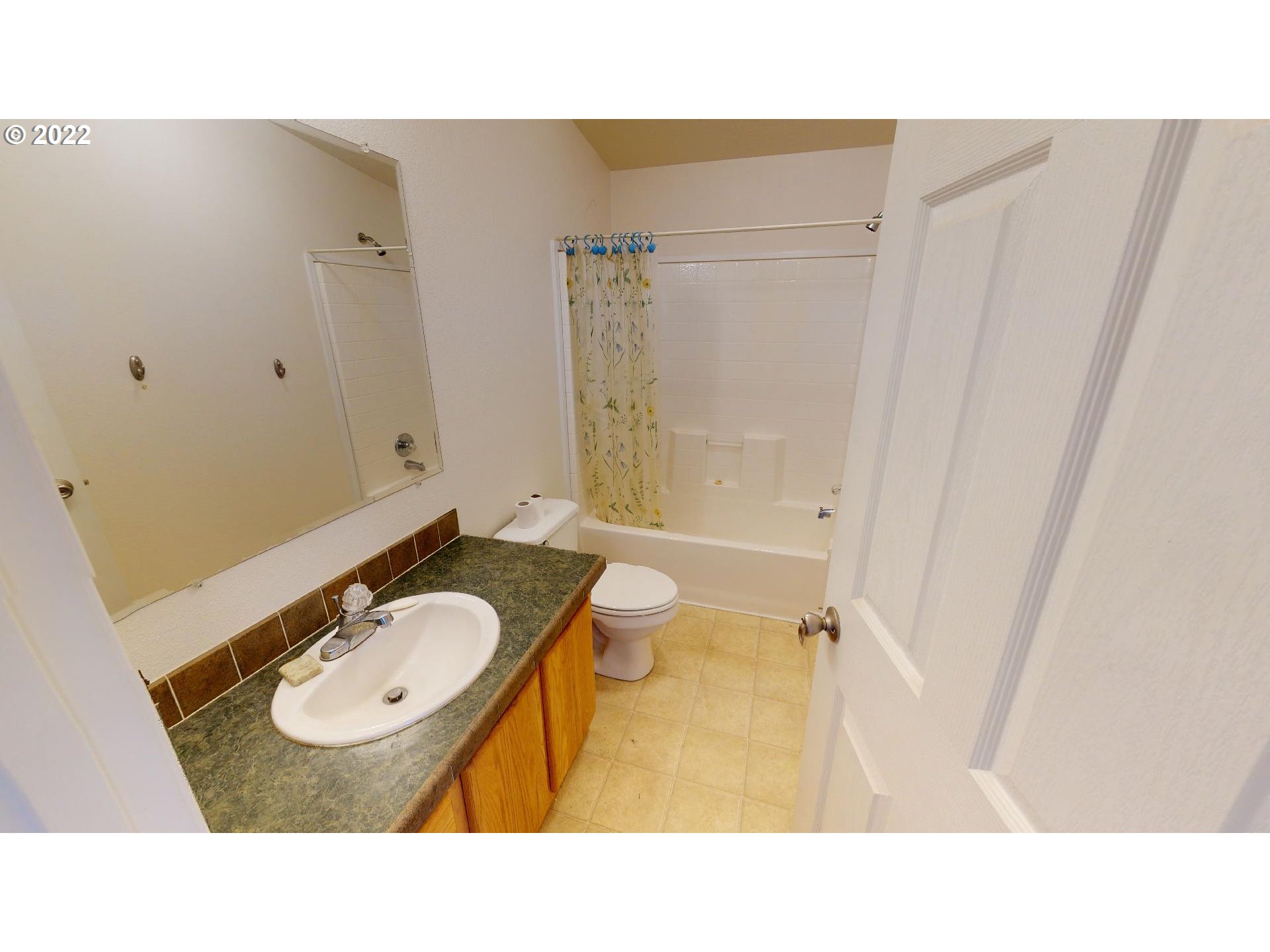 94635 Grange Road Gold Beach, OR 97444 - Photo 24 of 27 a bathroom with a sink a toilet a mirror and shower