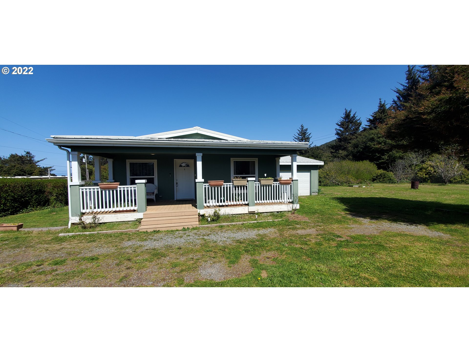 94635 Grange Road Gold Beach, OR 97444 - Photo 25 of 27 a view of an house with backyard space and balcony