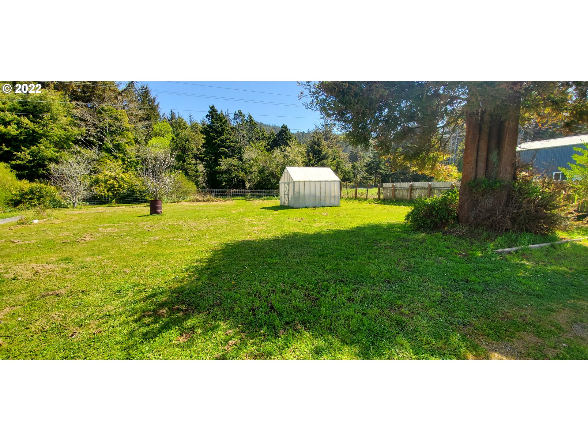 94635 Grange Road Gold Beach, OR 97444 - Photo 26 of 27 a view of a big yard with an outdoor seating