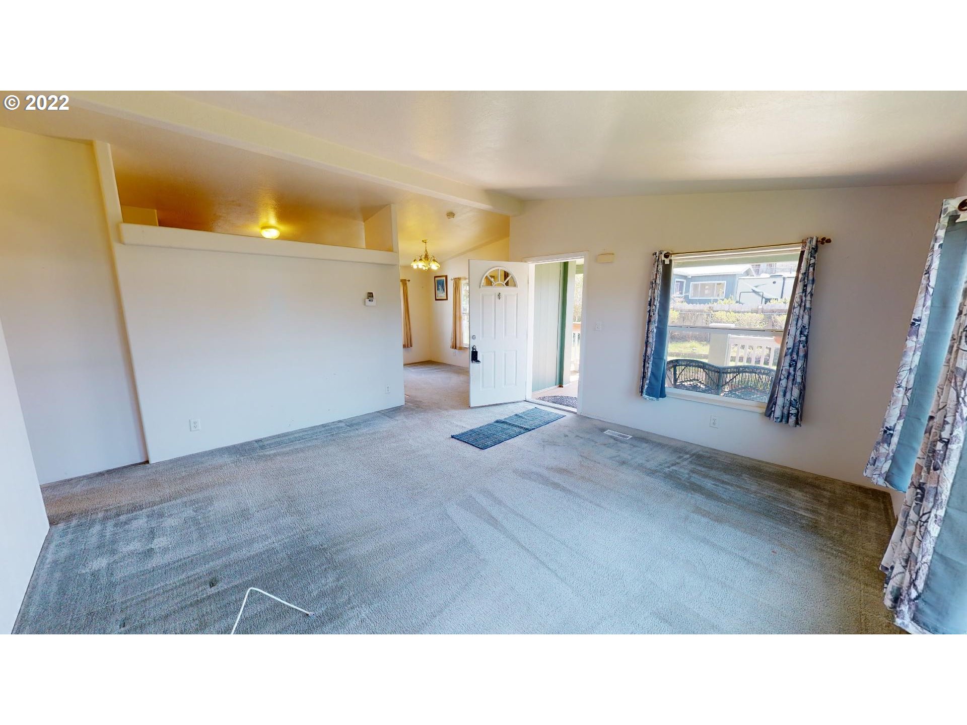 94635 Grange Road Gold Beach, OR 97444 - Photo 5 of 27 a open hall with a painting on the wall