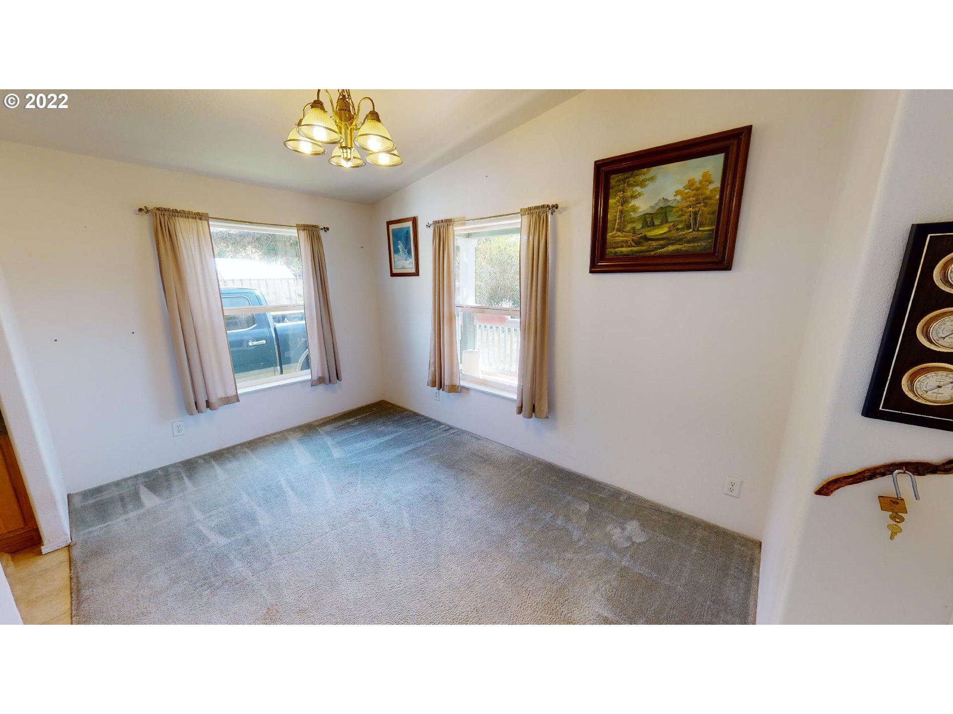 94635 Grange Road Gold Beach, OR 97444 - Photo 9 of 27 a open hall with a painting on the wall
