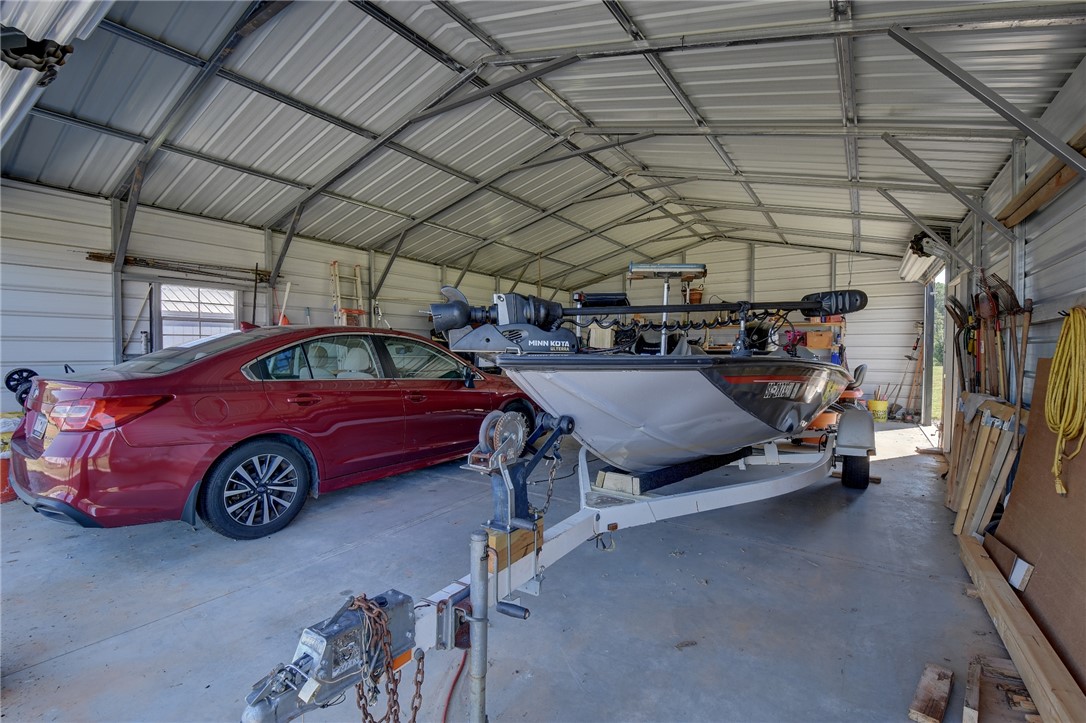 220 Clinkscales Road Anderson, SC 29624 - Photo 25 of 33 Metal outbuilding with concrete flooring provides abundant space for vehicles and recreational equipment.