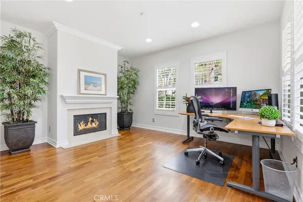 a view of a livingroom with a fireplace window and stairs