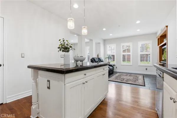 a kitchen with stainless steel appliances granite countertop a stove microwave and refrigerator